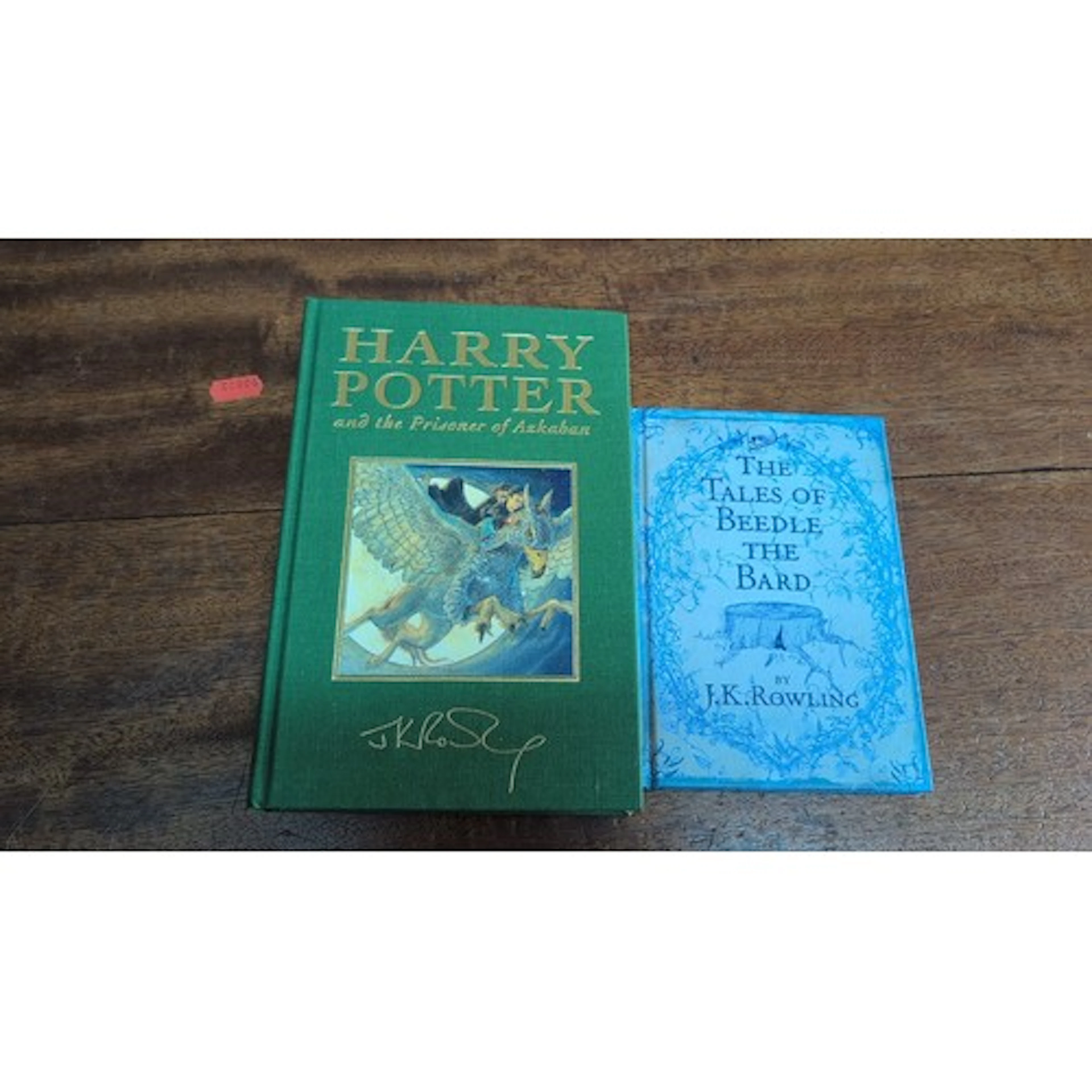 J.K. Rowling—two Harry Potter hardback volumes: Harry Potter...