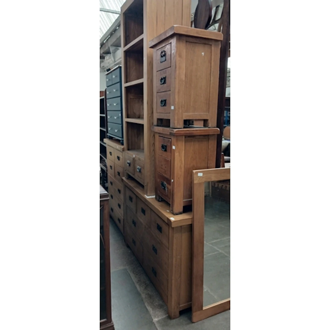 A suite of light oak furniture comprising two chests of draw...