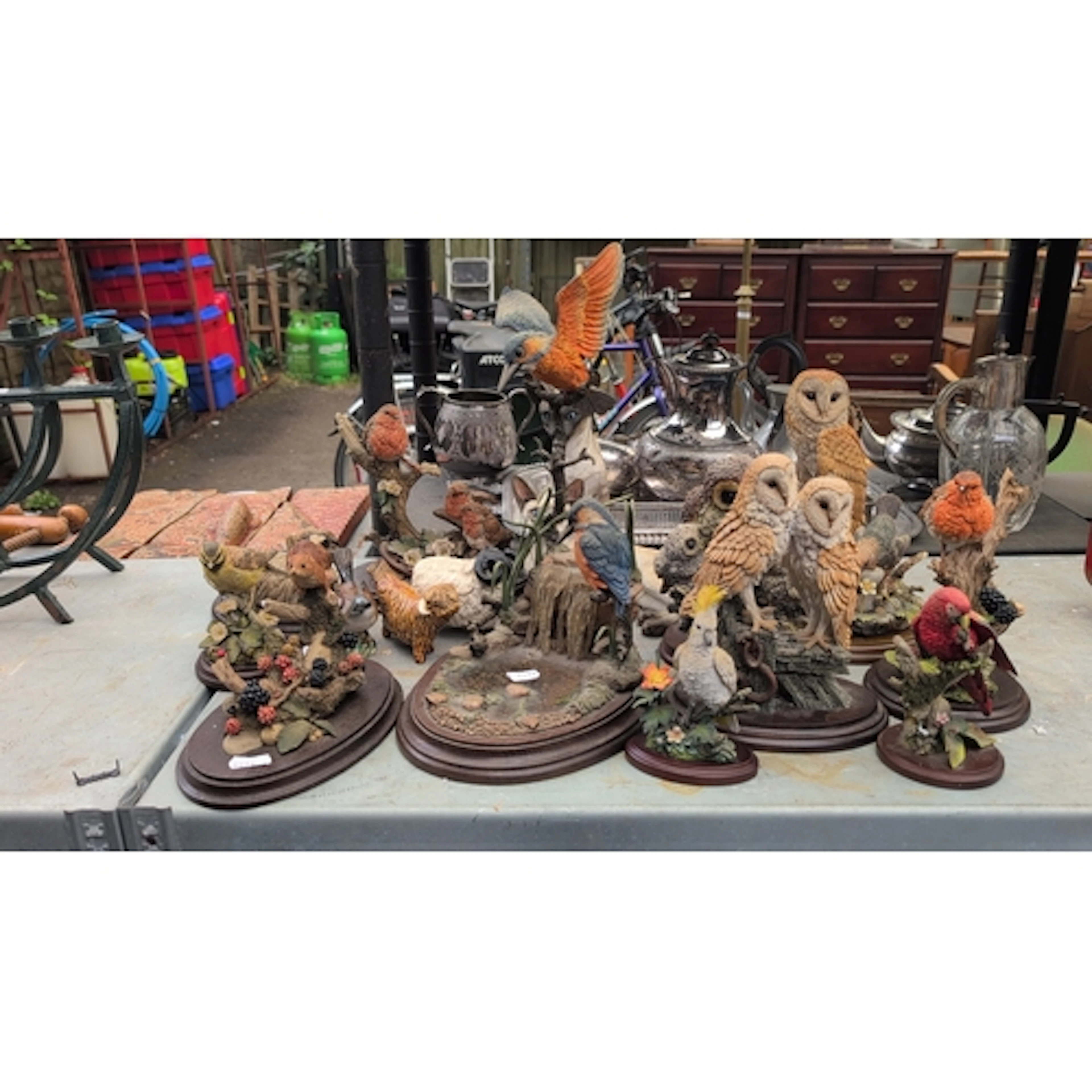 A quantity of wildlife animal figurines, predominantly birds...