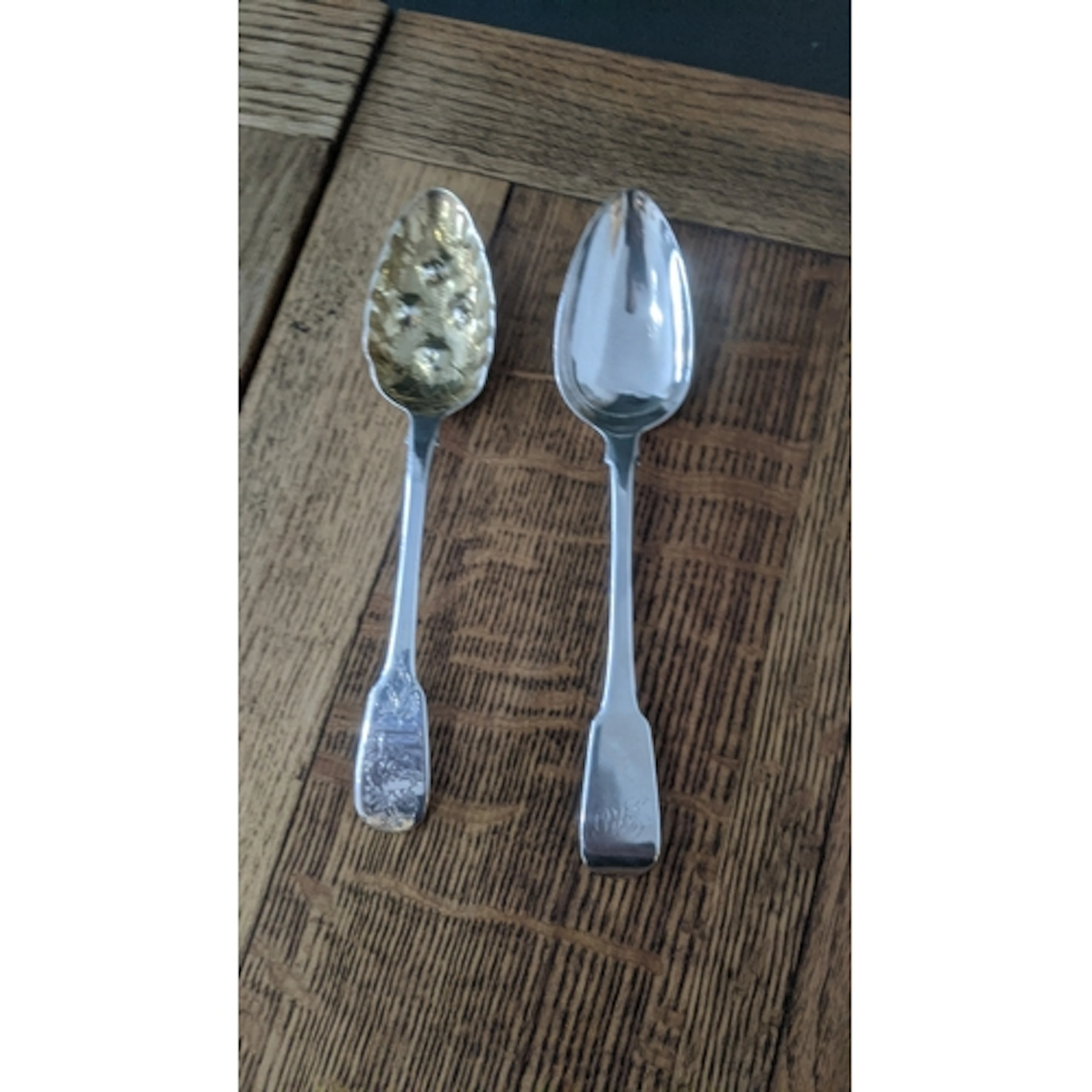A silver berry spoon having a gilt bowl, hallmarked London 1...