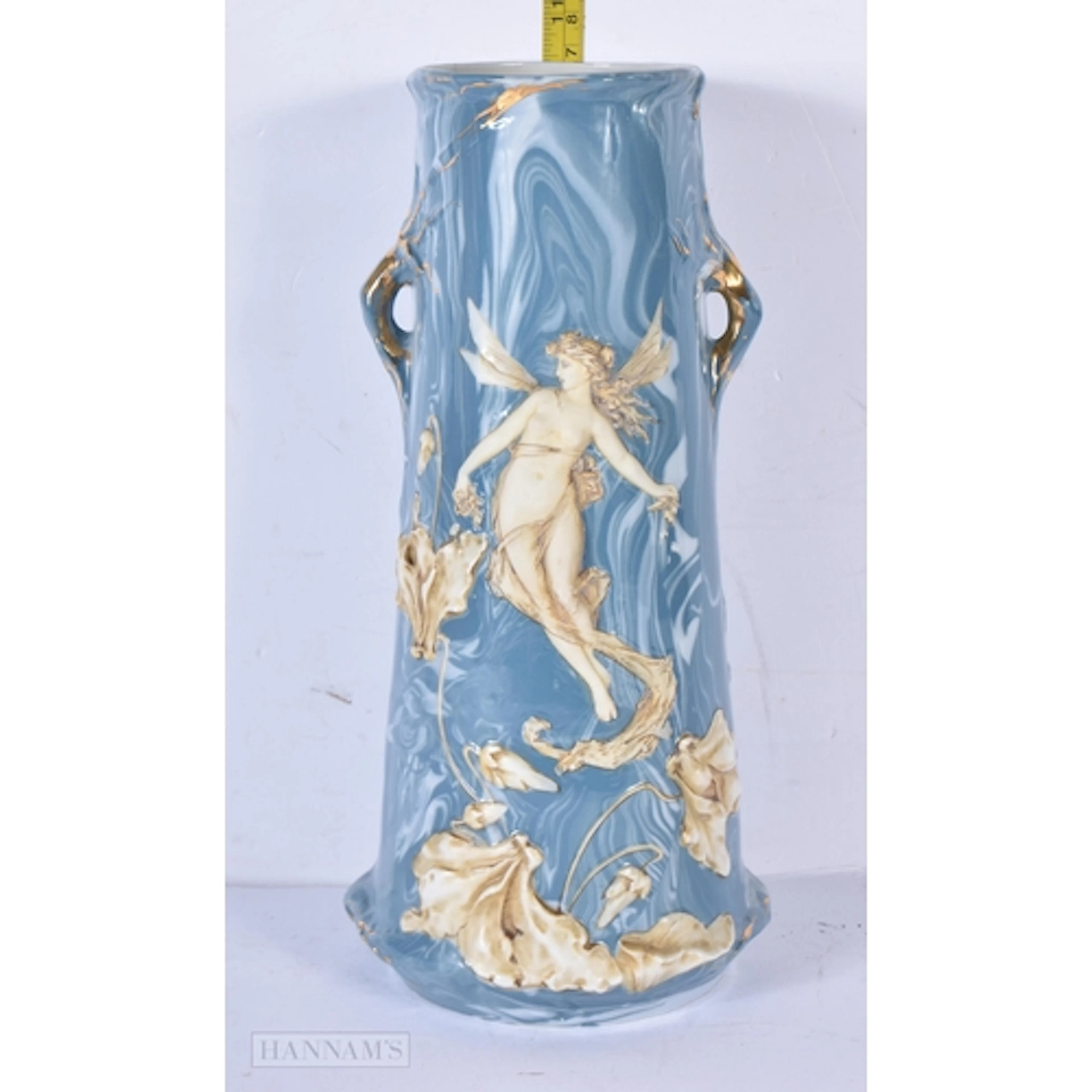 An Art Nouveau Royal Dux vase decorated with a winged femal...