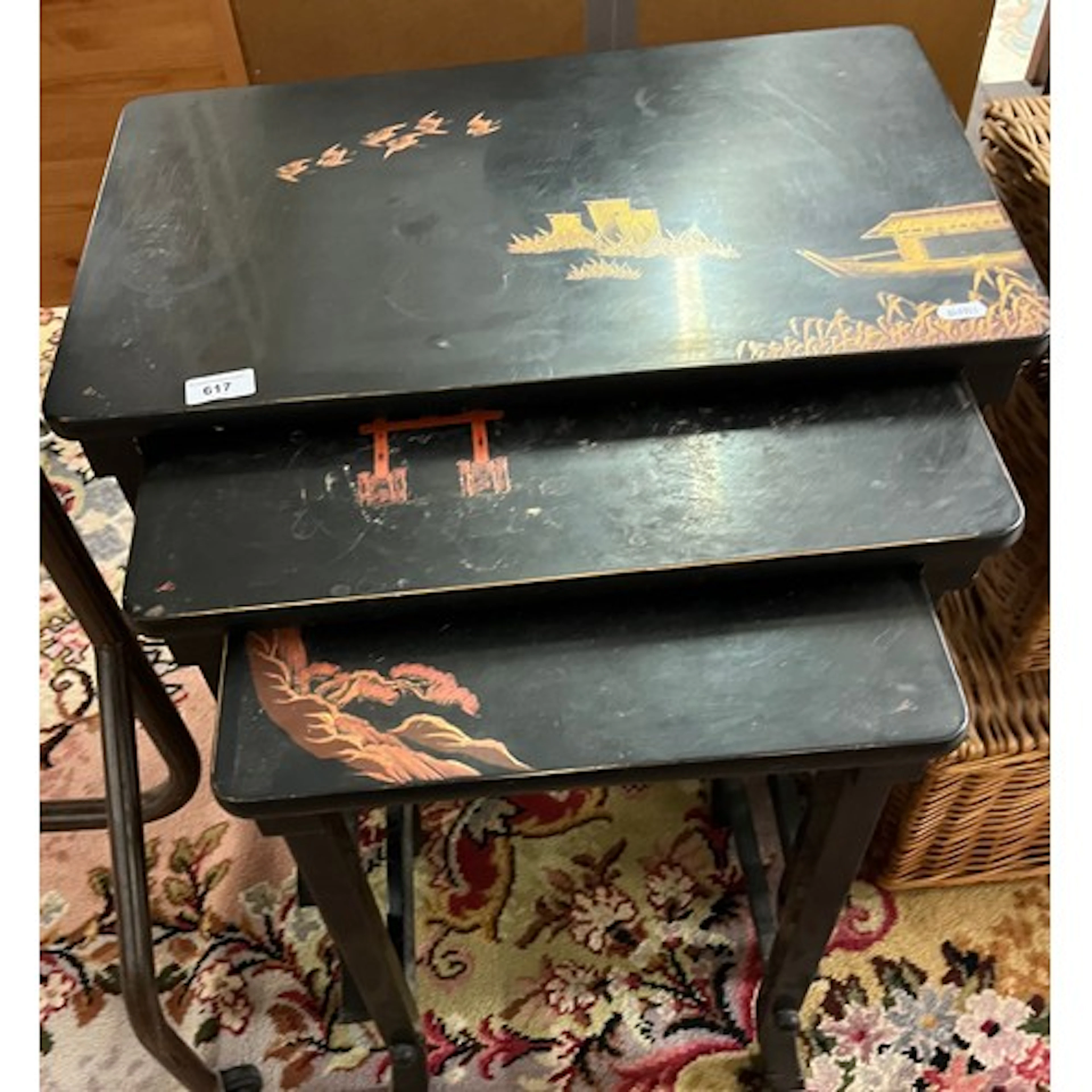 Nest of three Oriental lacquered tables.