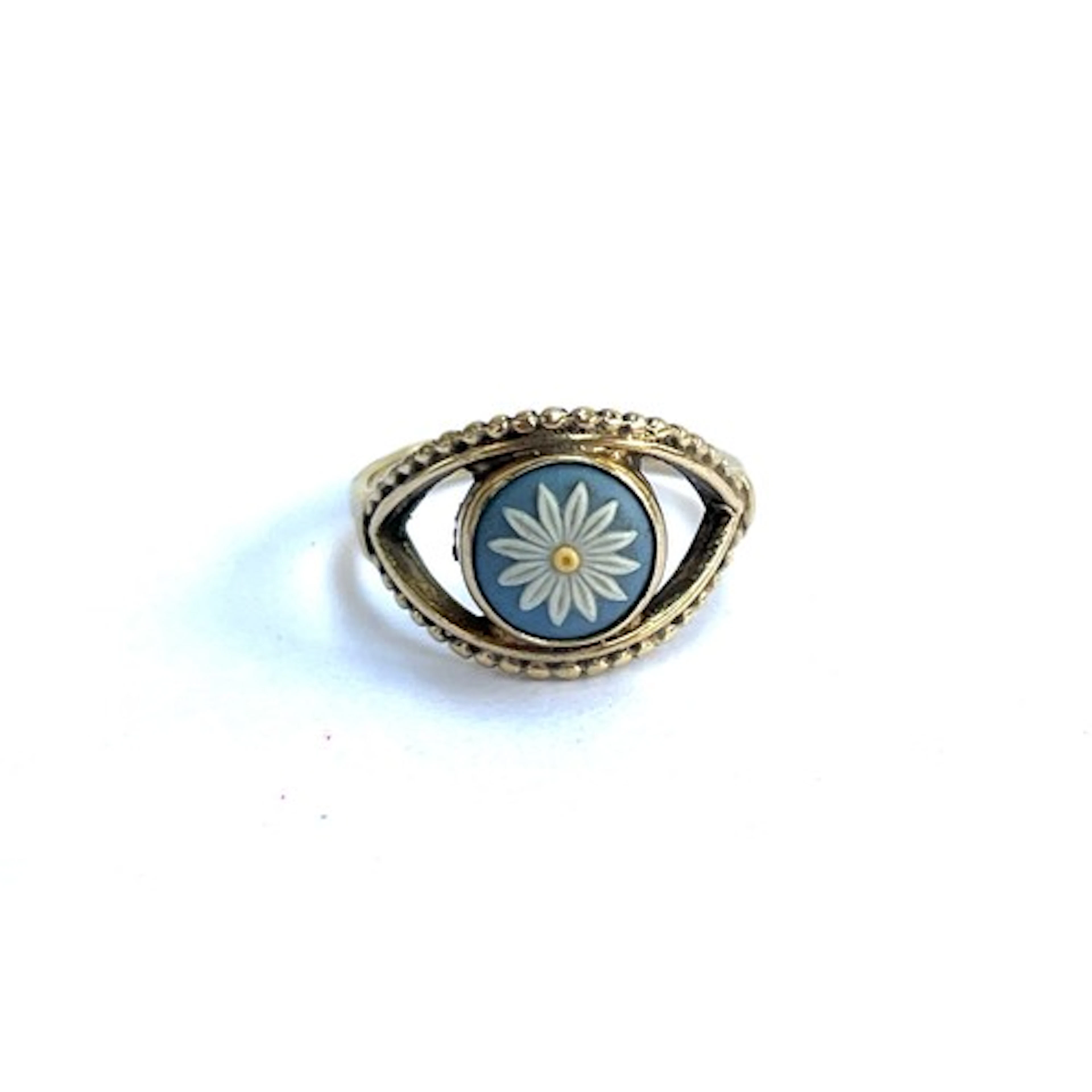 A silver ring set with a Wedgwood jasperware floral plaque, ...