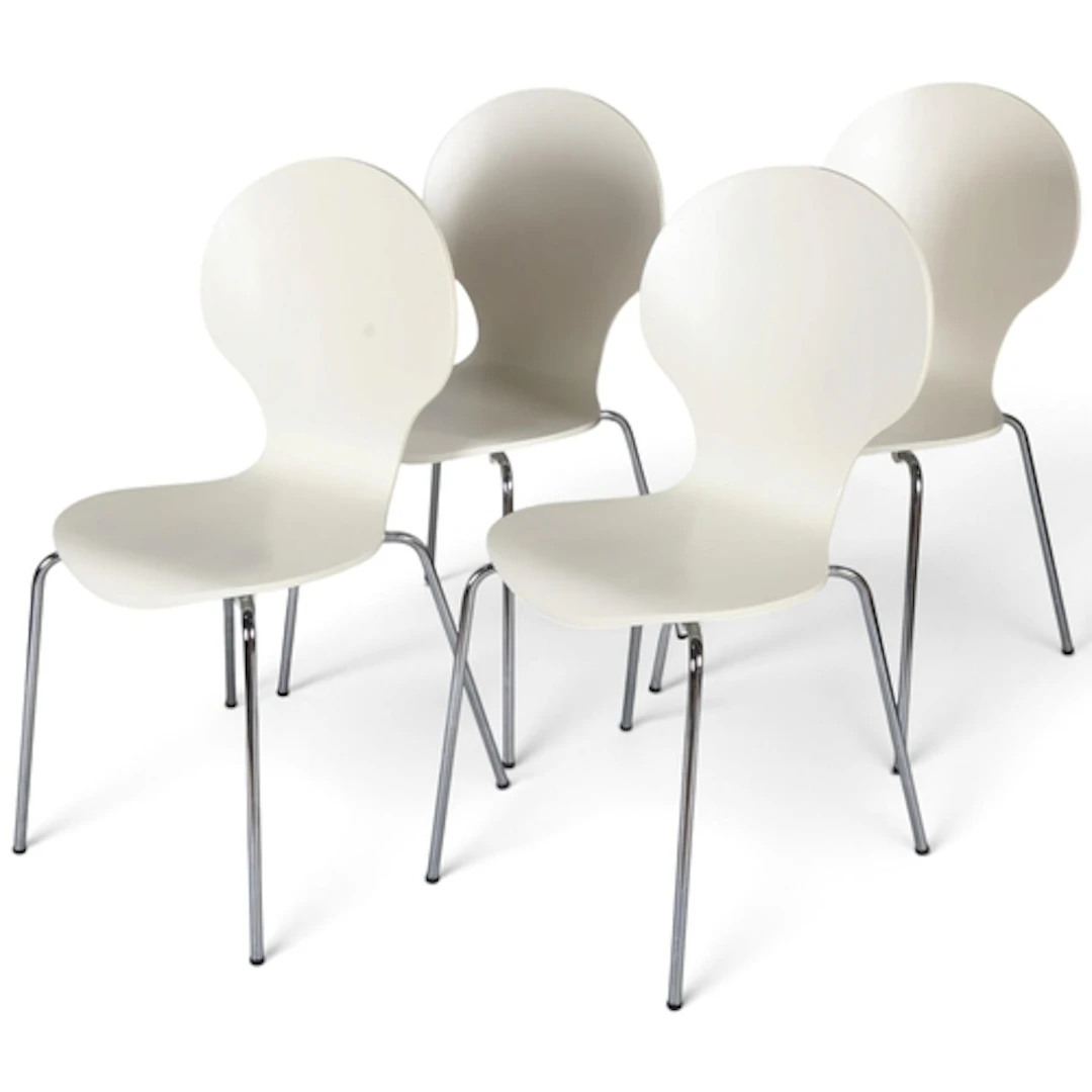 A set of four modern bent plywood chairs, ivory coated on st...