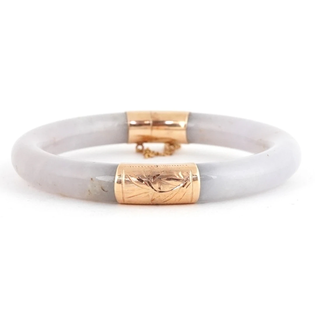 Chinese 14ct gold and white stone bangle, tests as jade, 7.5...