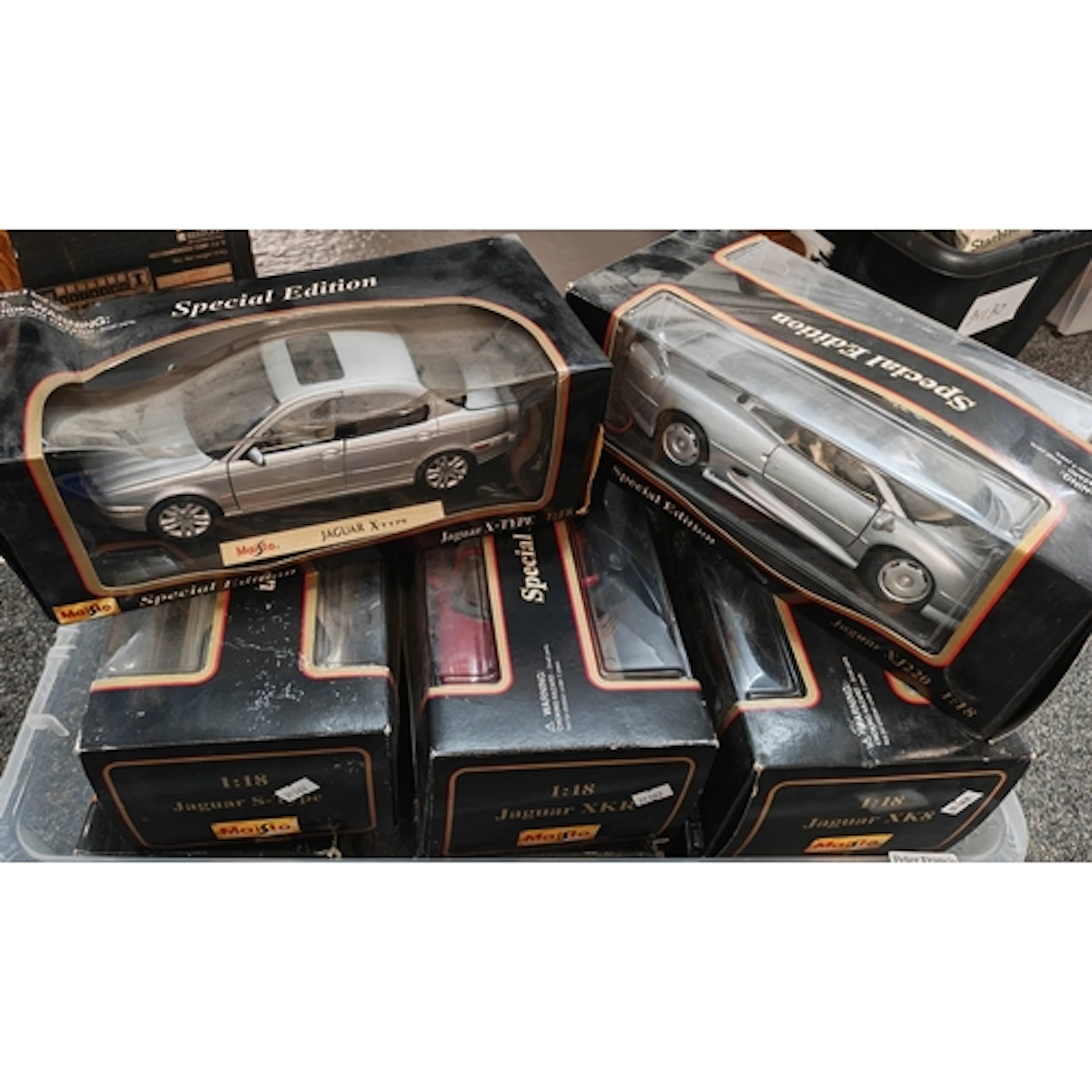 Collection of eight Maisto 1:18 scale vehicles in original b...