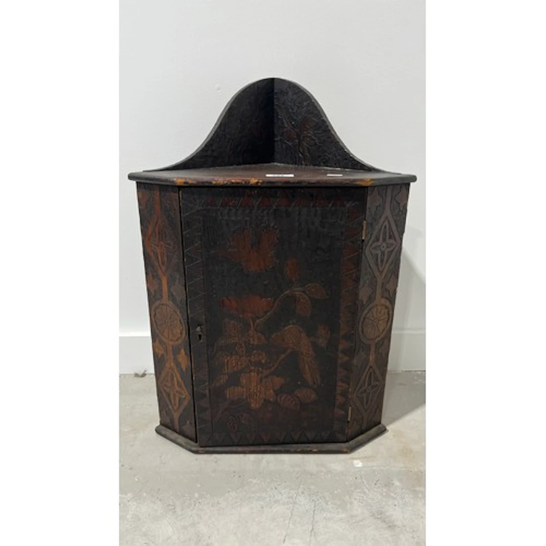 Pine carved corner cupboard, canted corners depicting birds ...