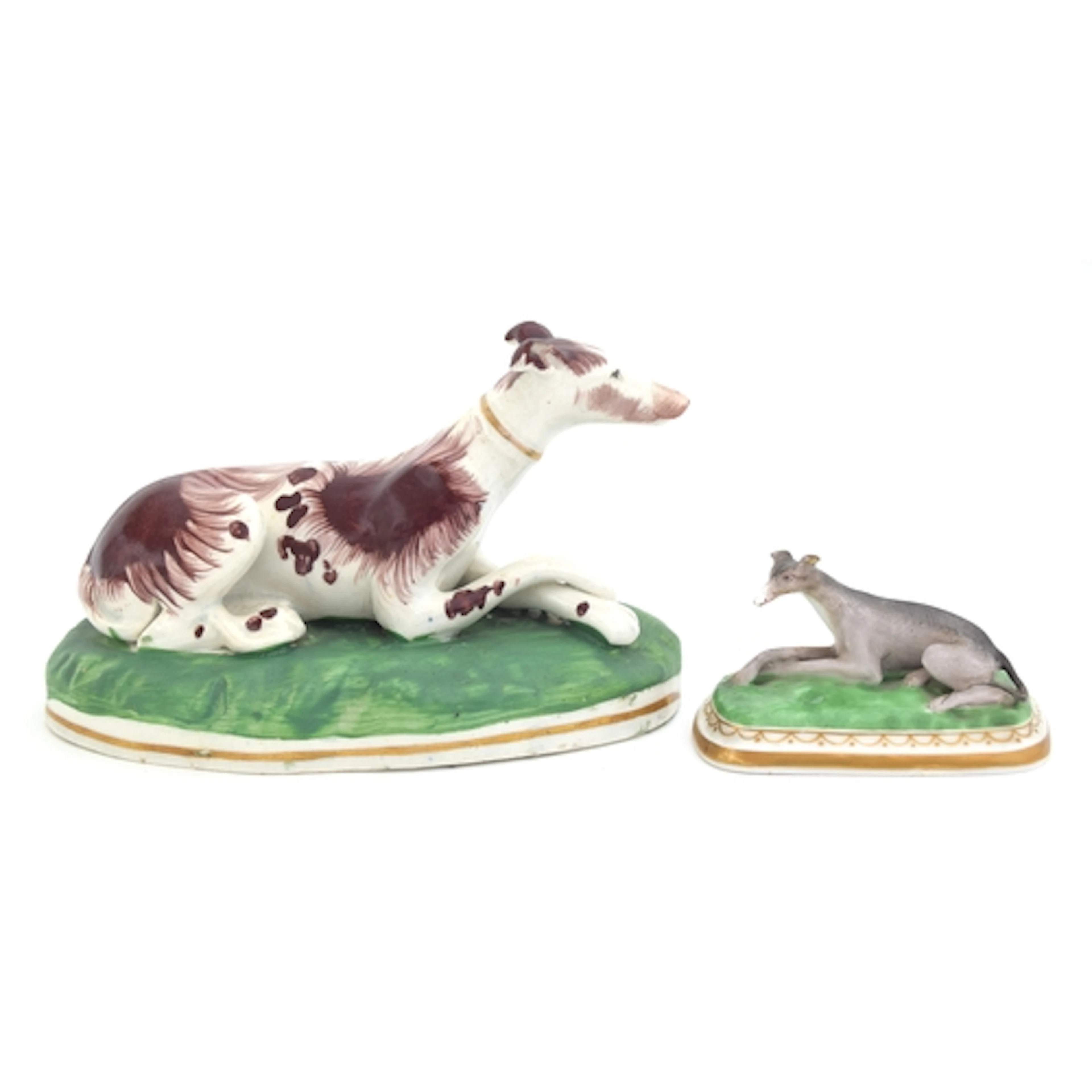 A 19th century Staffordshire figure of a recumbent longdog, ...