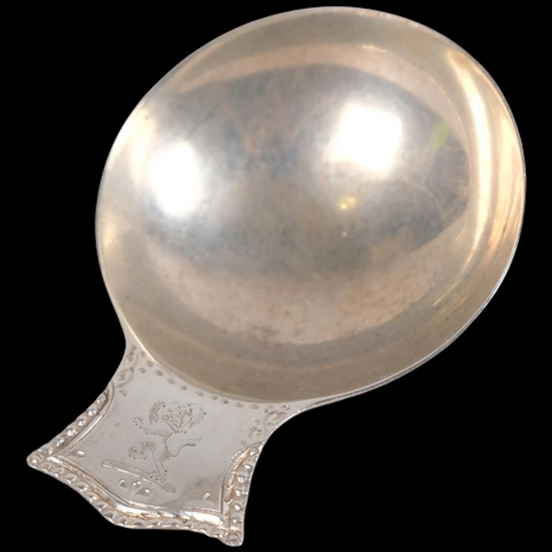 An 18th century silver tea caddy spoon, possibly George Smit...