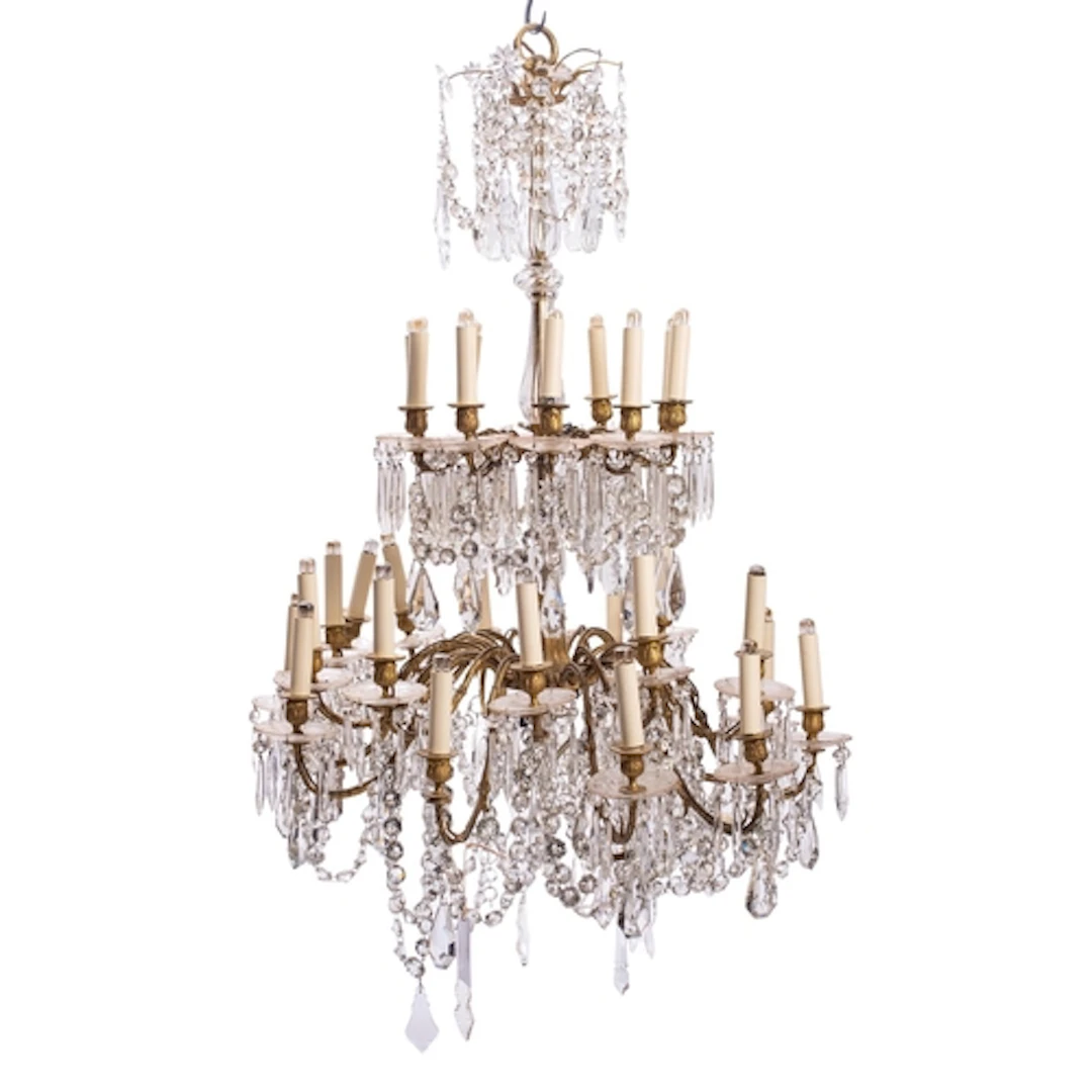 A gilt metal and cut glass thirty-light chandelier in early ...