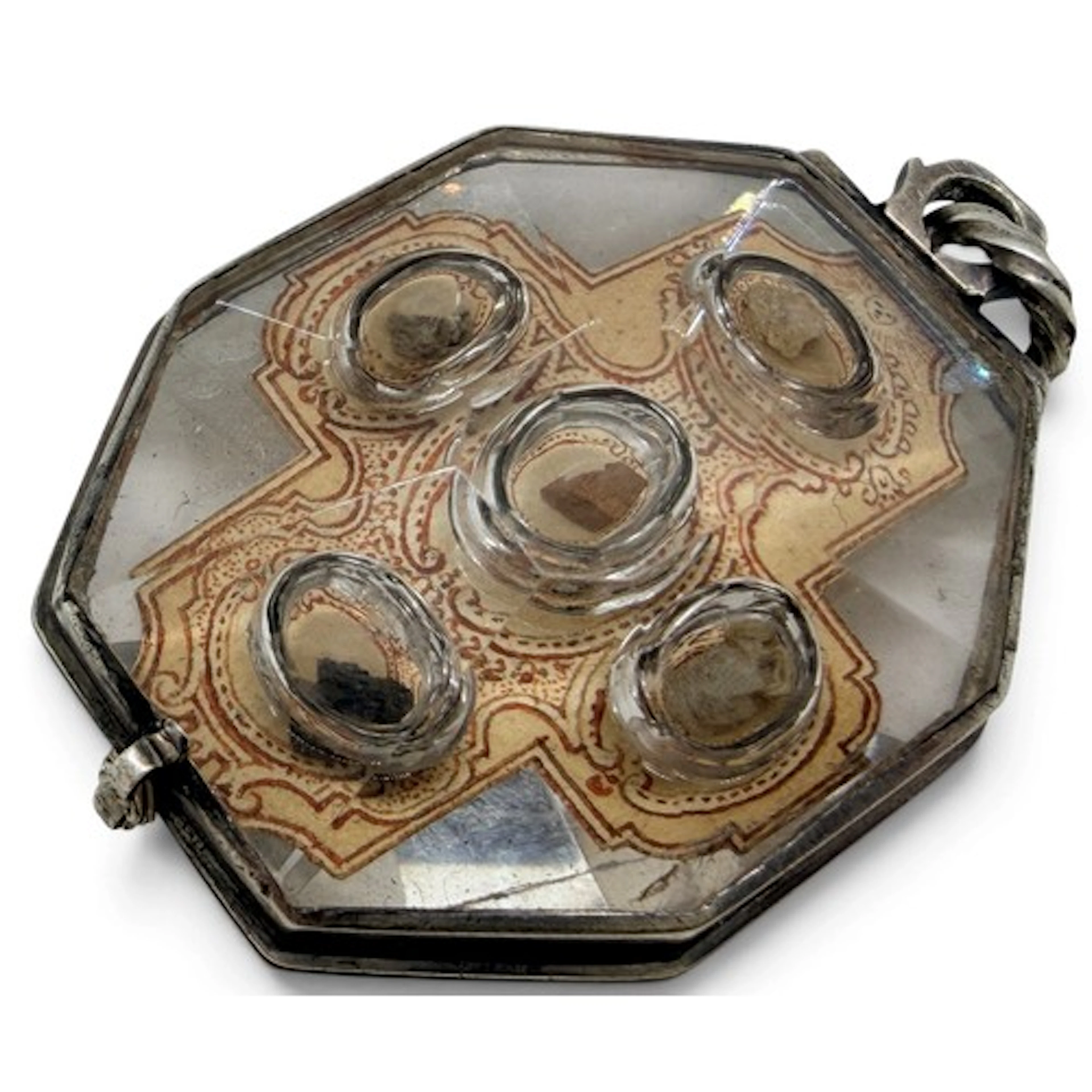 A rock-crystal reliquary pendant mounted in white metal with...