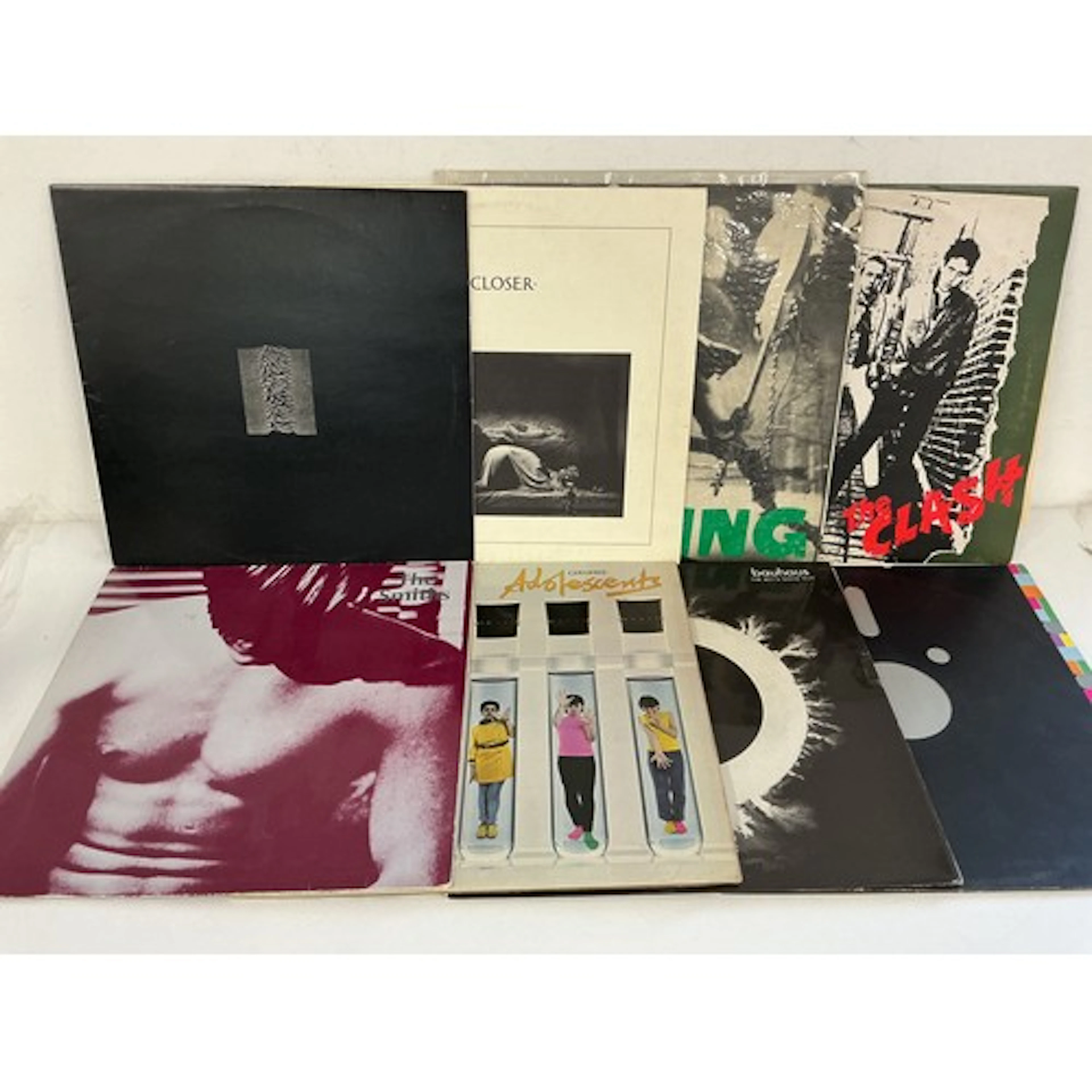 Sixteen punk and new wave LPs and 12” singles by various art...