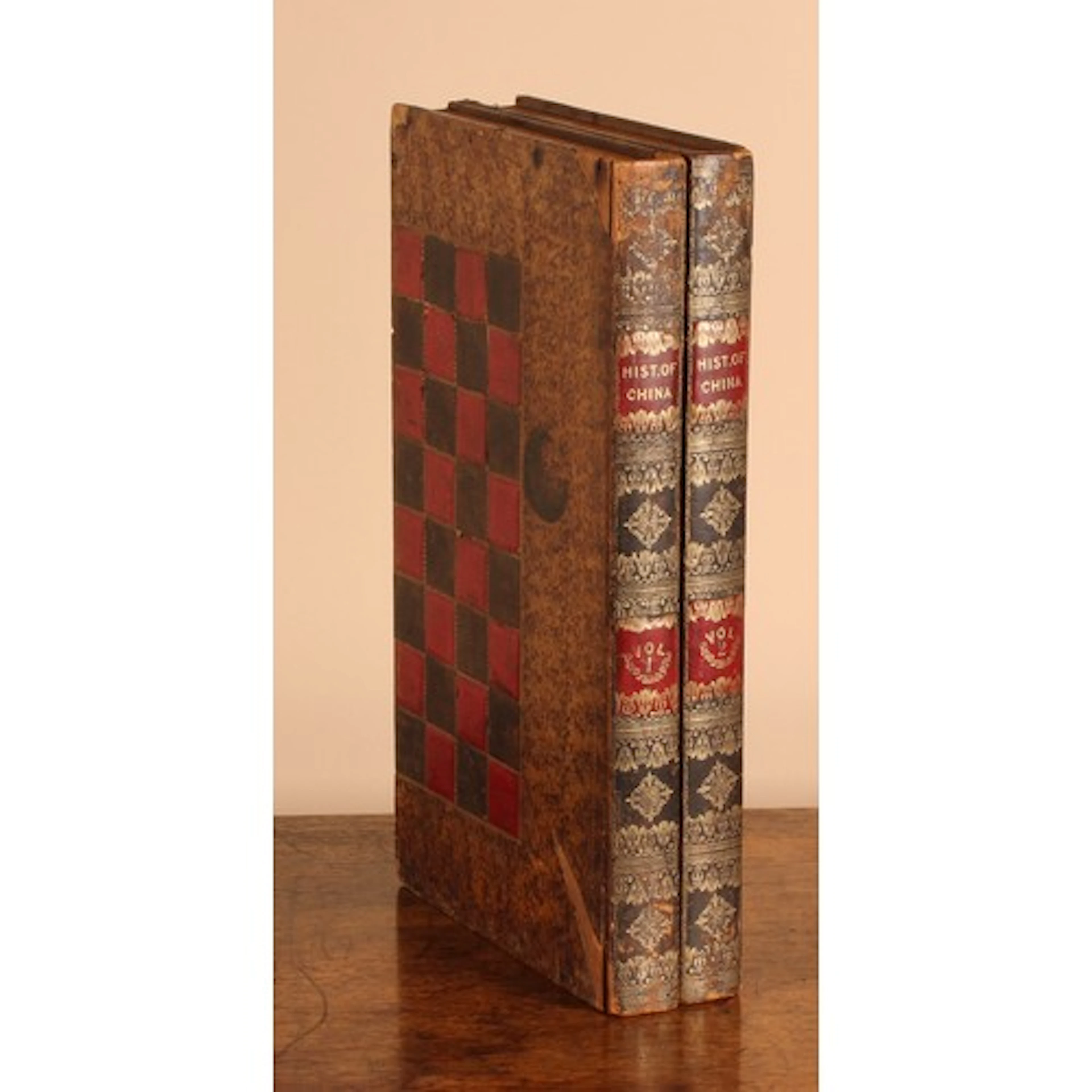 A leather and gilt-tooled chess and draughts board, modelled...