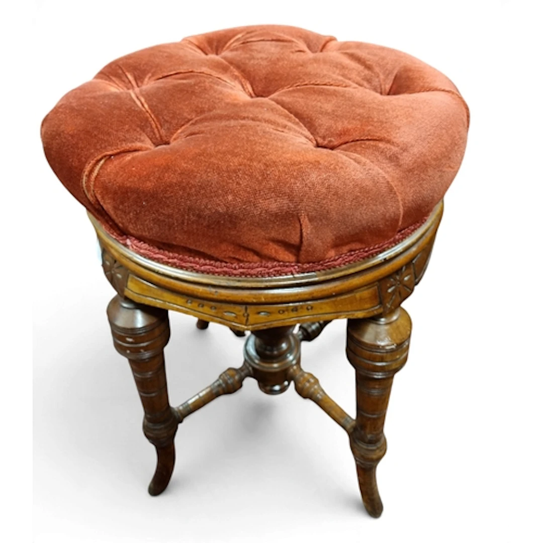 A 19th Century Mahogany rise and fall Stool with deep button...