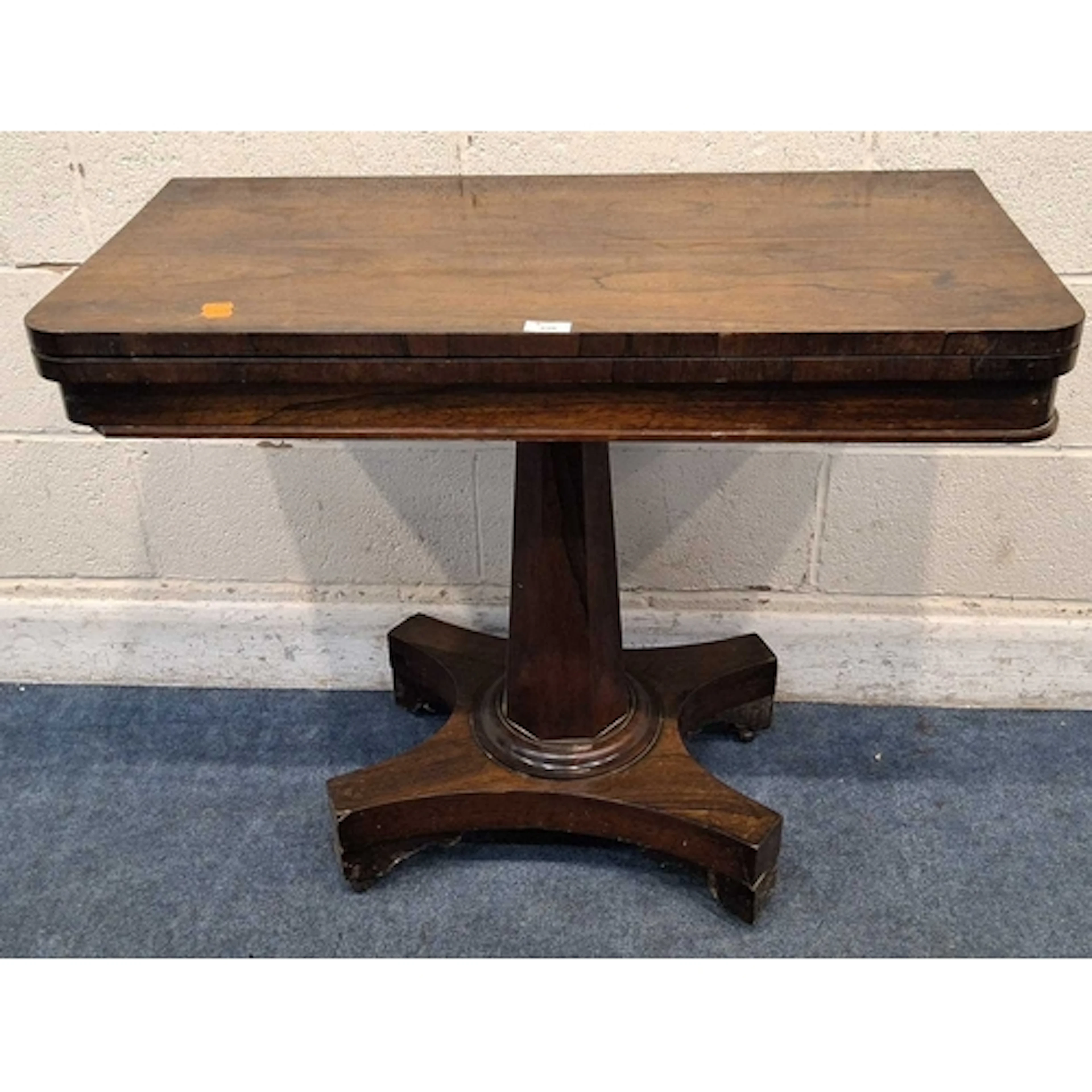A VICTORIAN ROSEWOOD GAME / CARD TABLE, with a rotating fold...