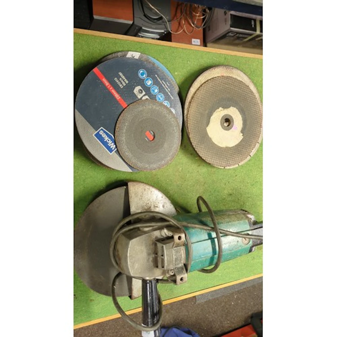 An electric angle grinder with auxiliary handle, together wi...