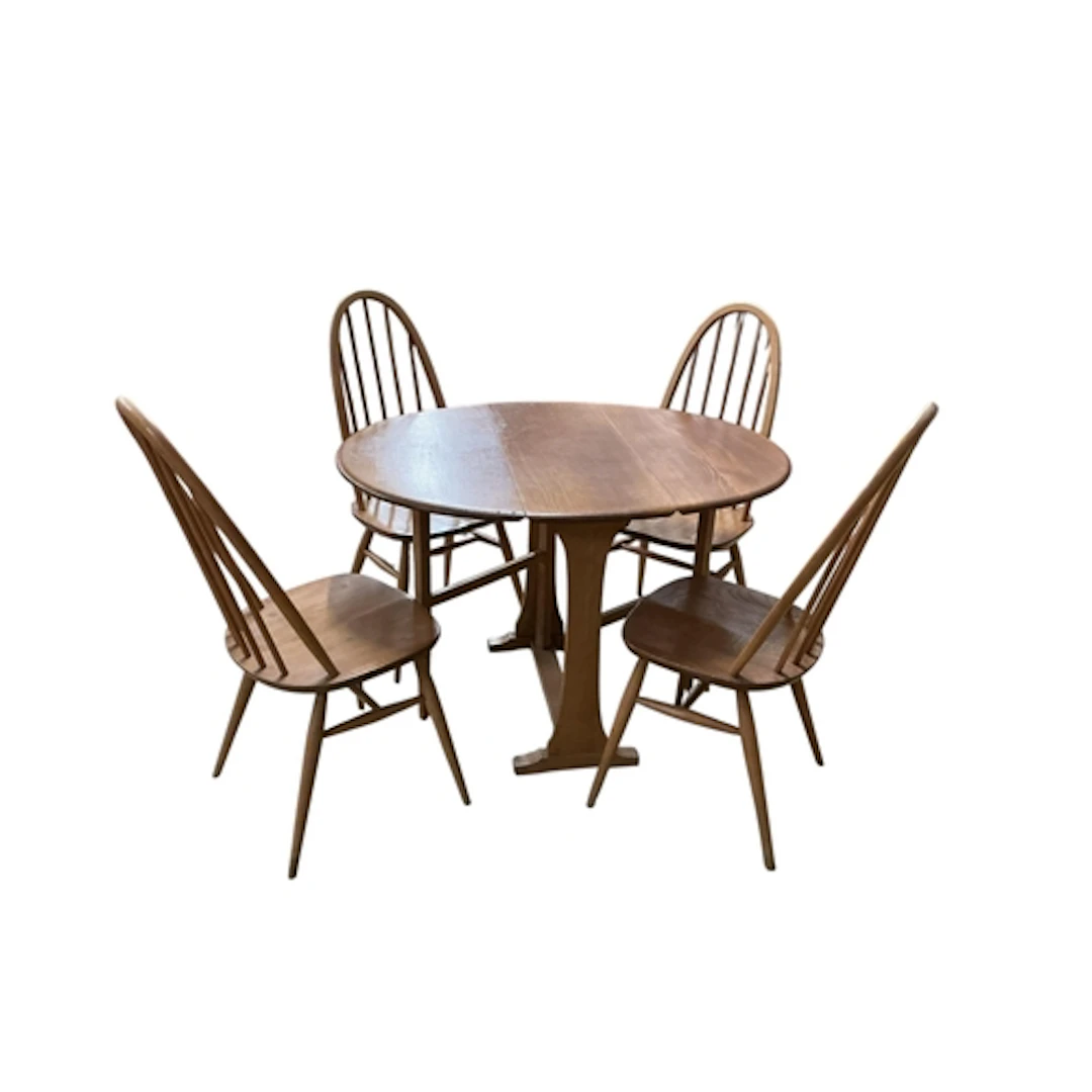 An Ercol medium elm dining table and four chairs, table widt...