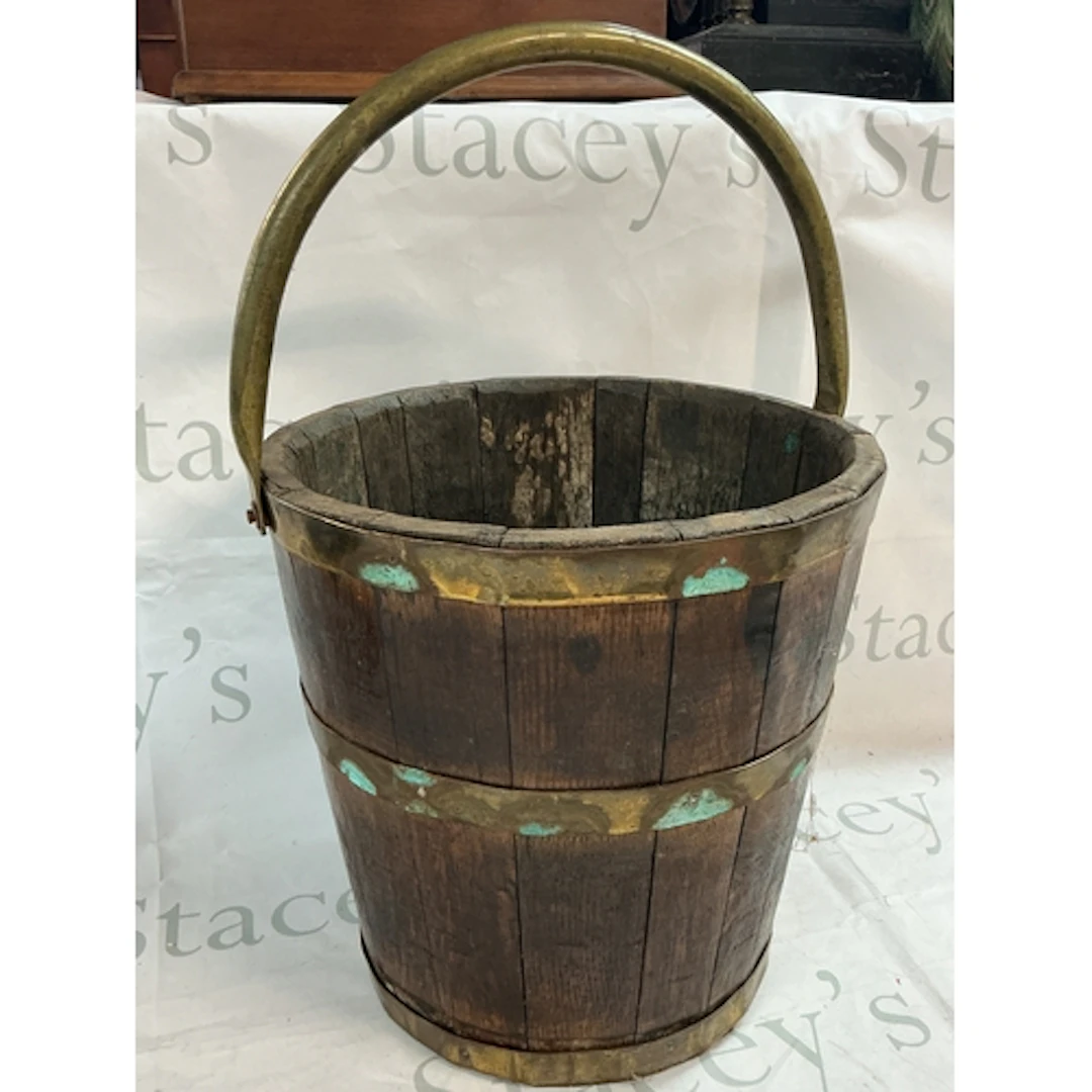 A brass bounded oak bucket, 31cm tall