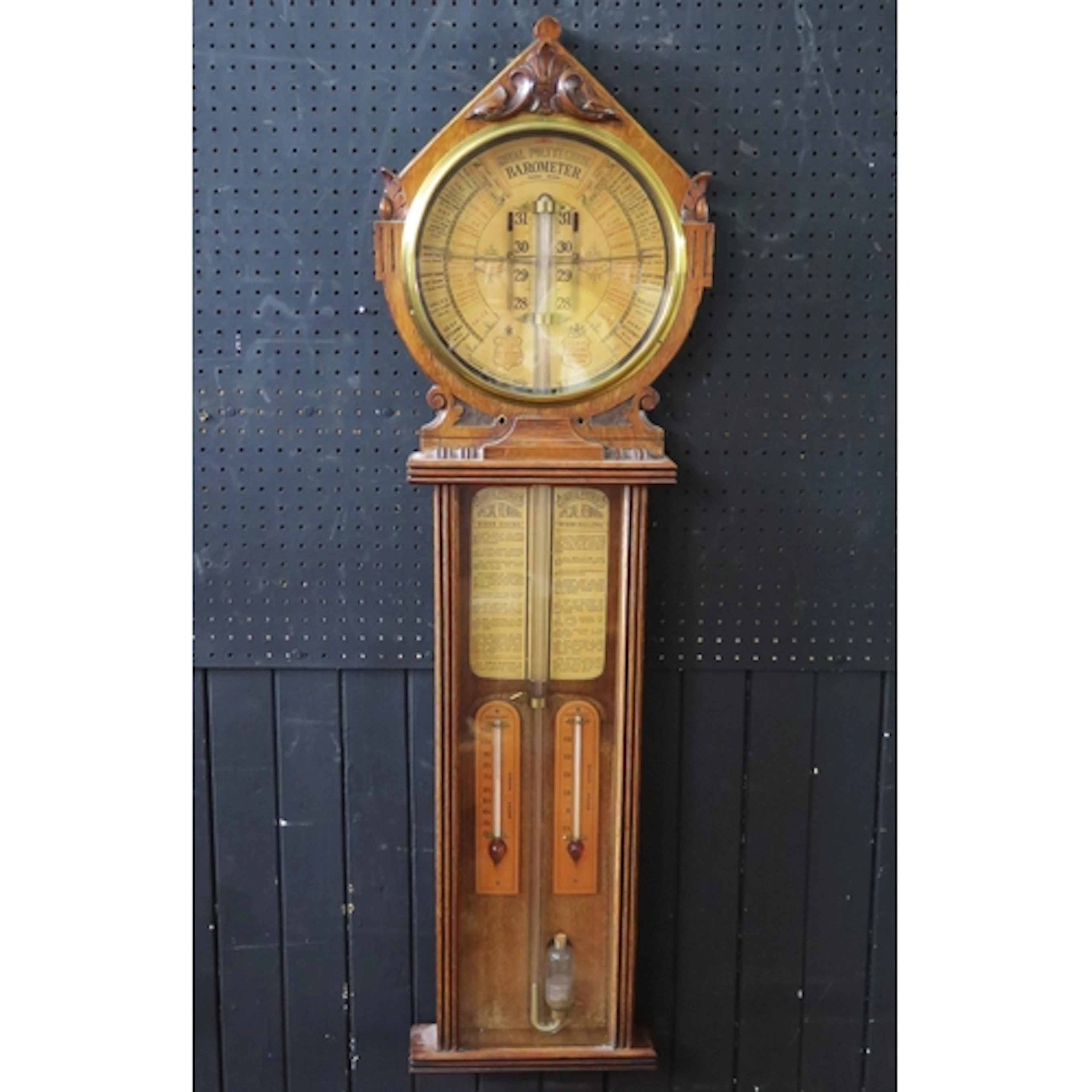 A Royal Polytechnic Barometer contained in an oak case, with...