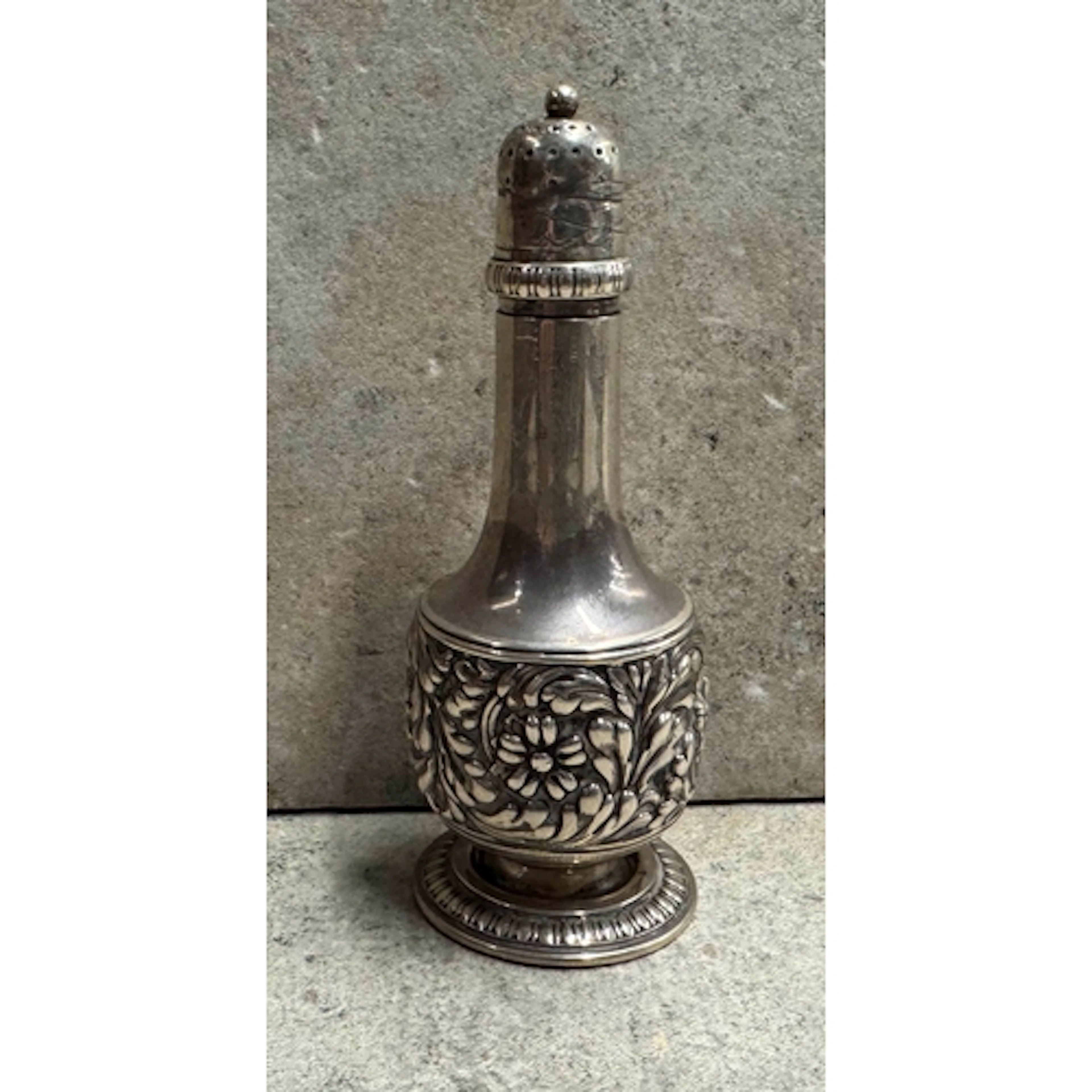 TIFFANY AND CO: A silver caster with chased decoration. Appr...