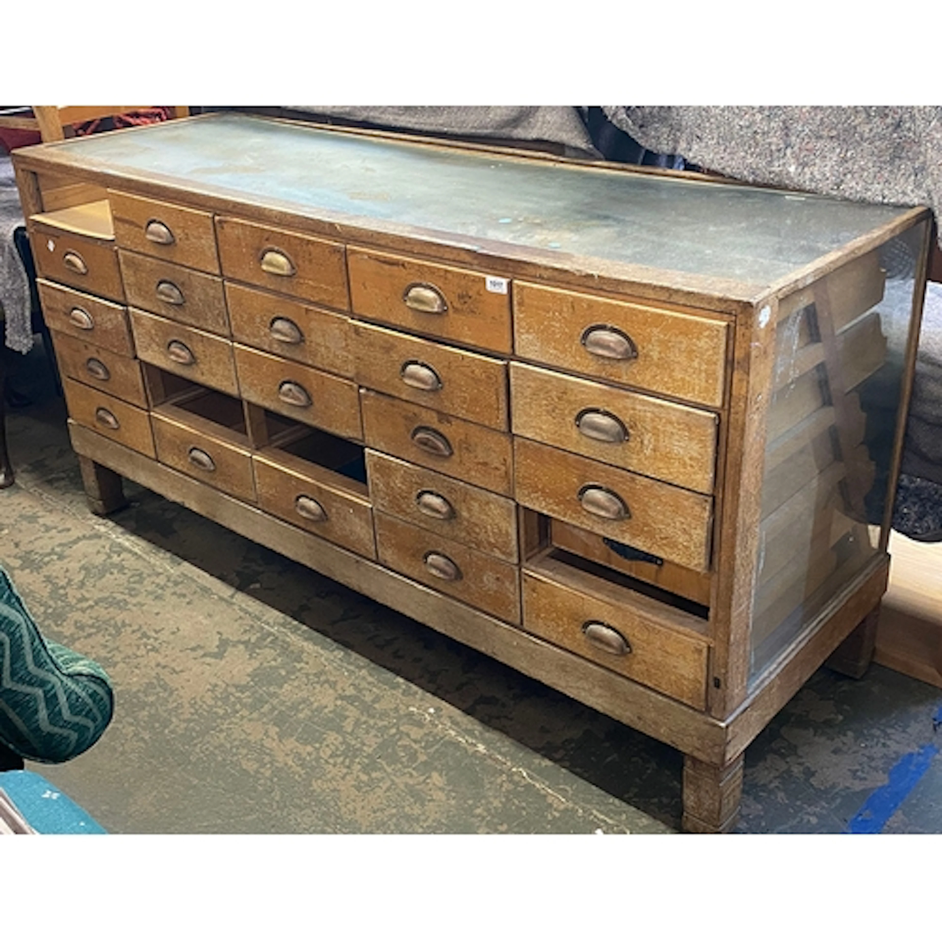 An early 20th century oak haberdashers cabinet, glazed on fo...