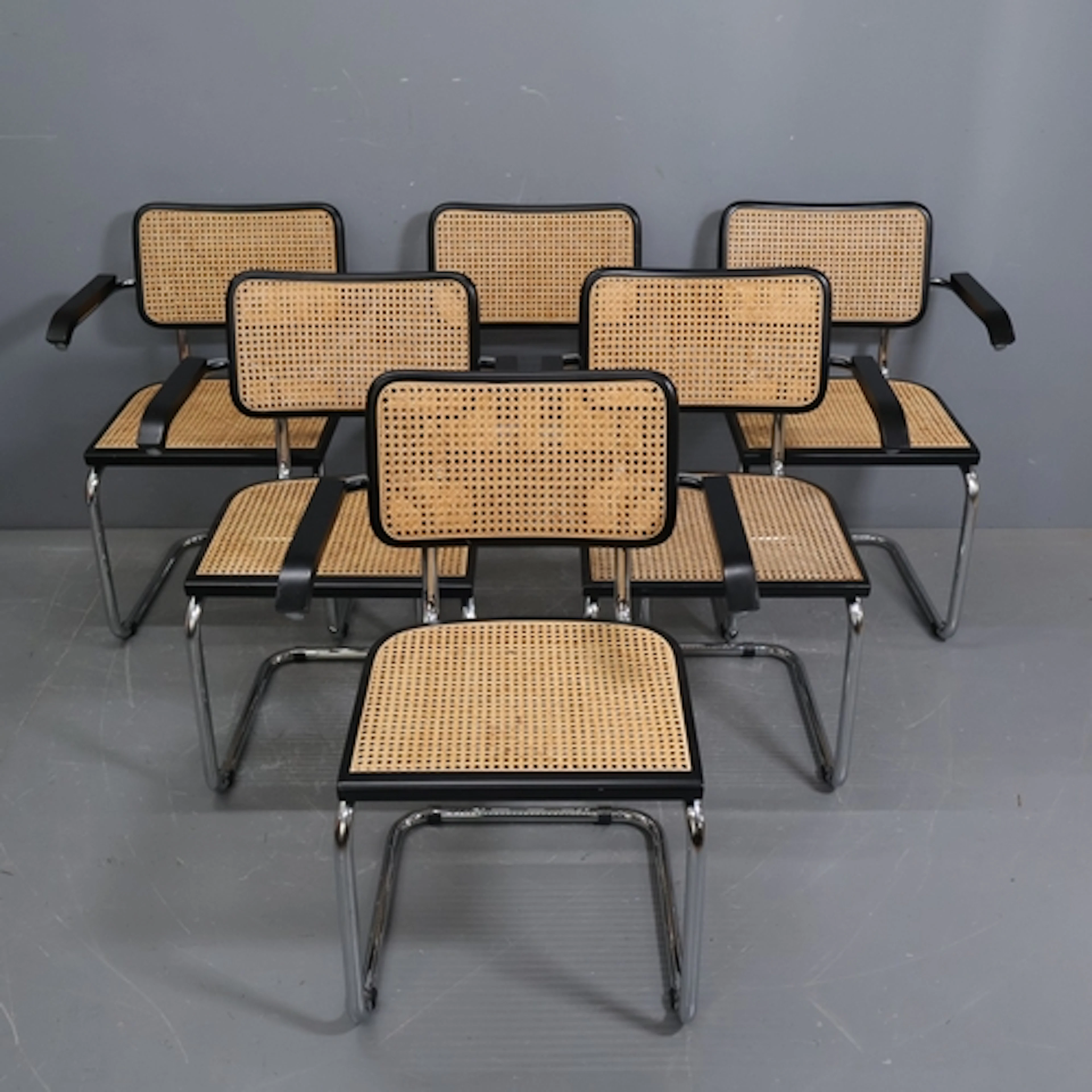 A set of 6 Marcel Breuer Cesca design dining chairs with arm...