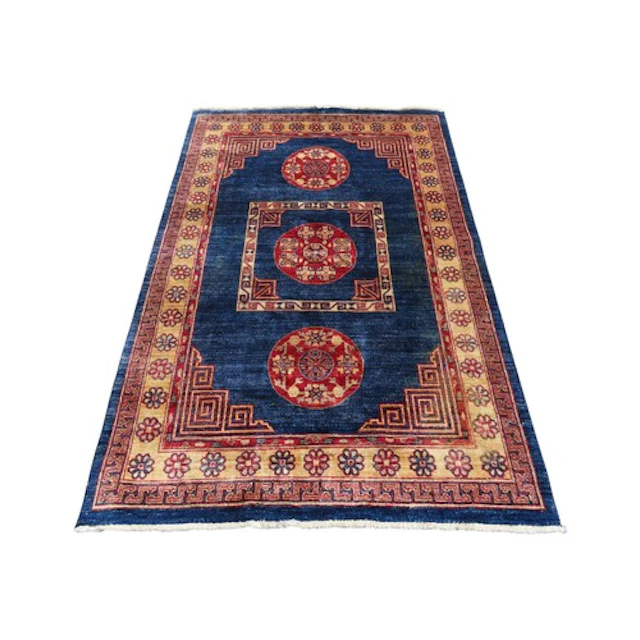 A Fardian Tibetan design rug with a blue field with Tibetan ...