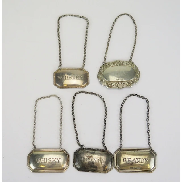 Three silver decanter labels, various makers and dates, 31.8...