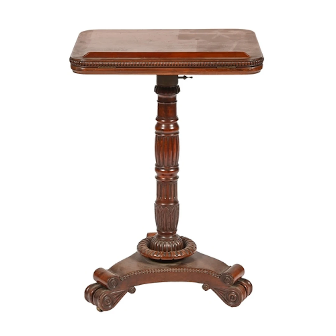 A George IV mahogany reading stand, with adjustable top and ...