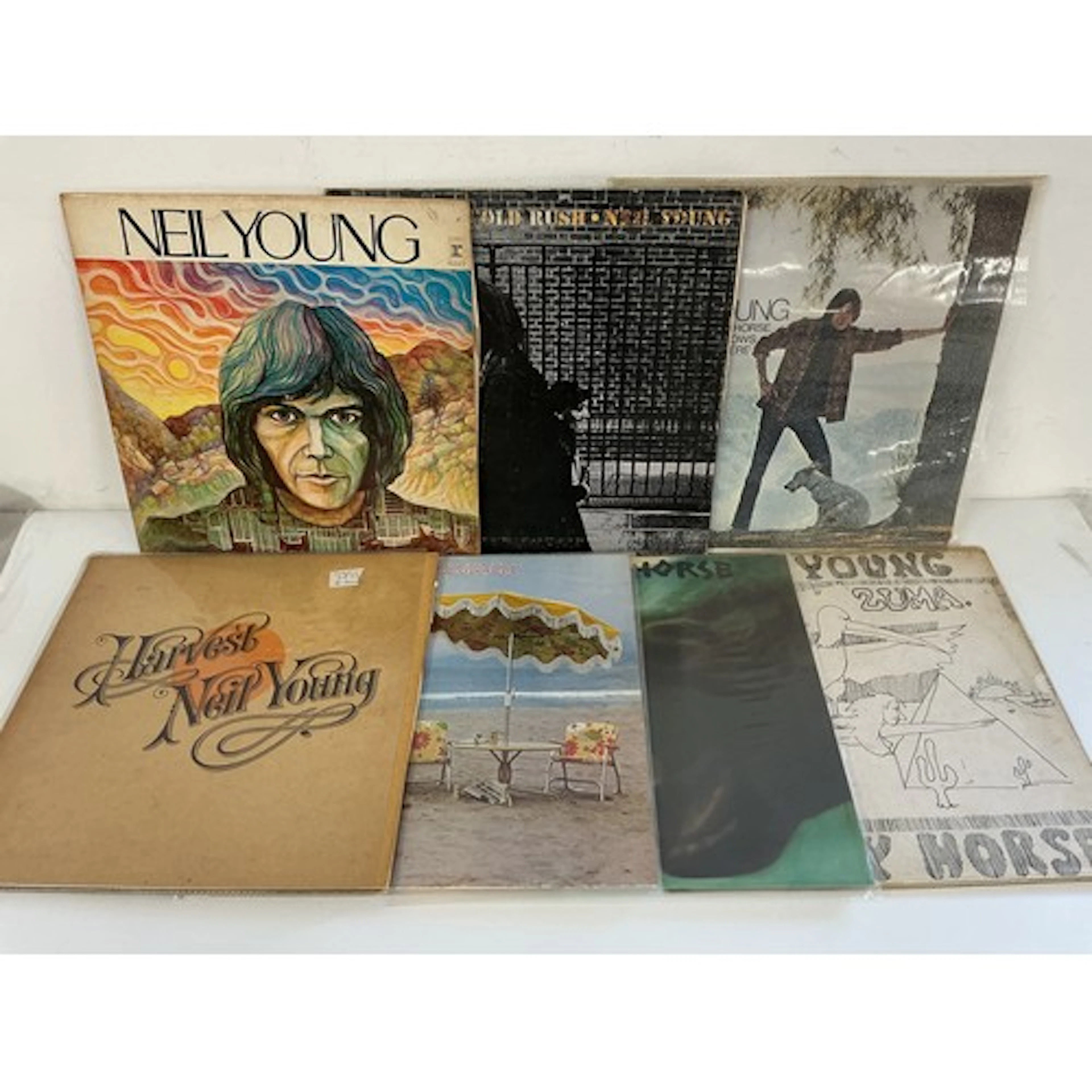 Two bags containing fourteen Neil Young and related LPs comp...