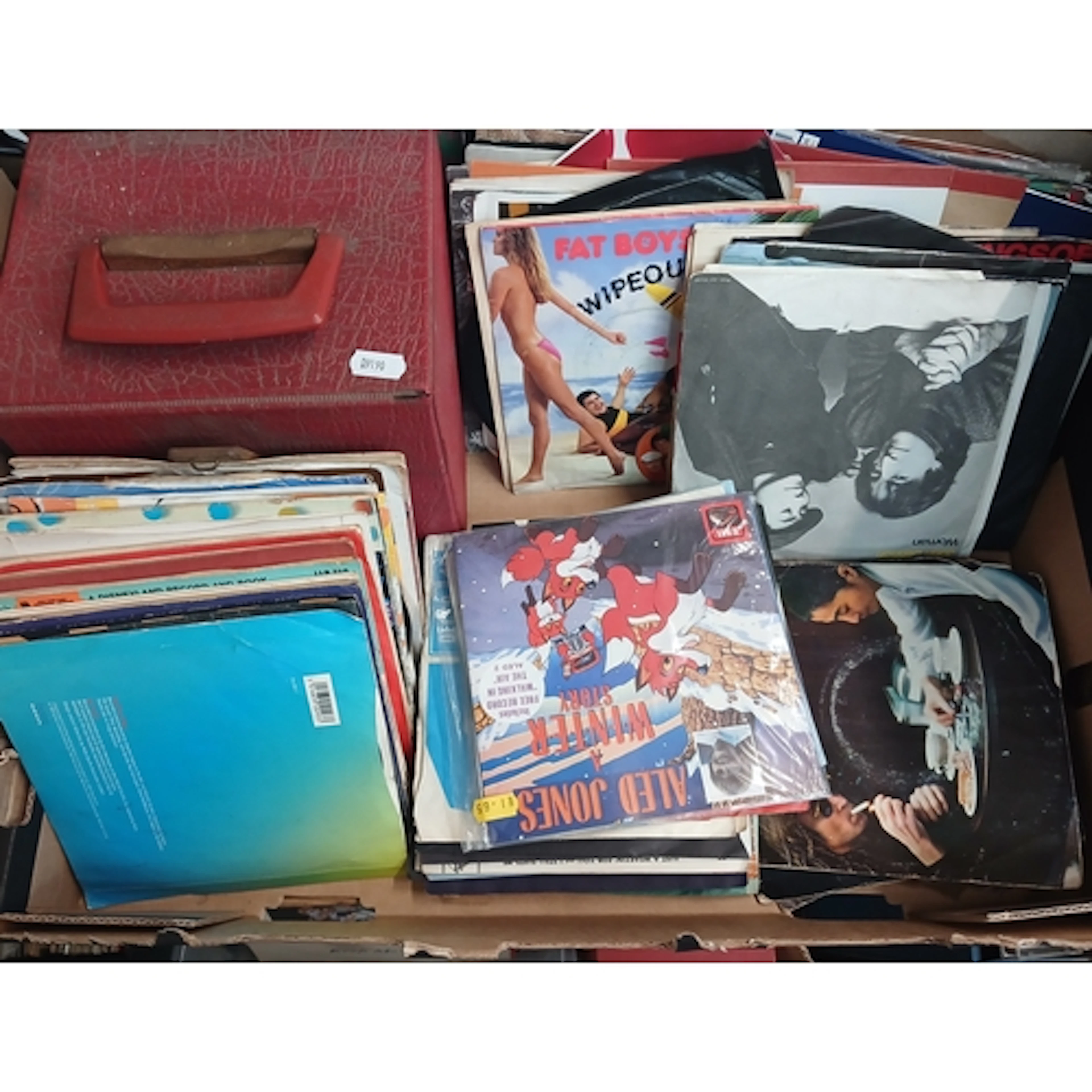 A box of assorted 7" singles, various artists.