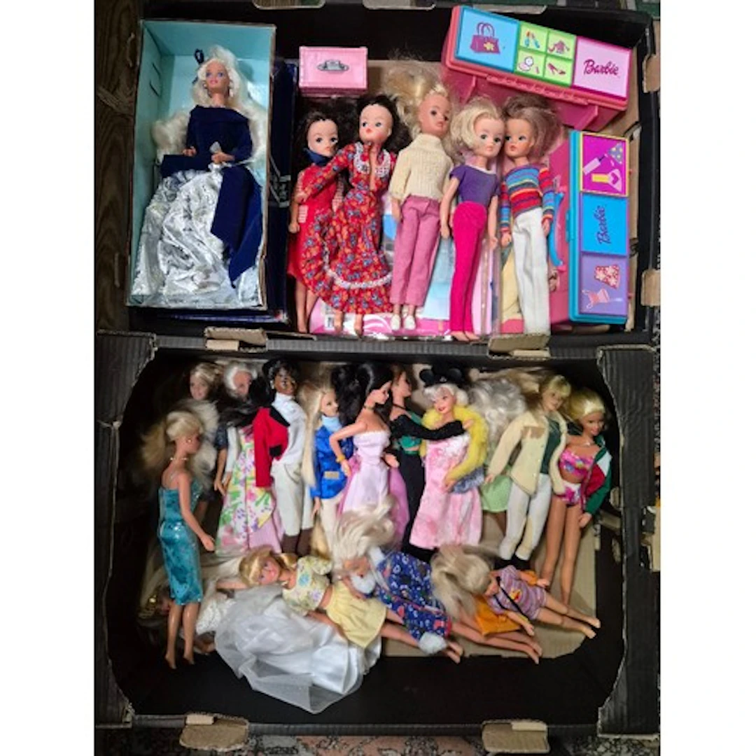Two boxes of assorted vintage dolls to include Barbie & Sind...