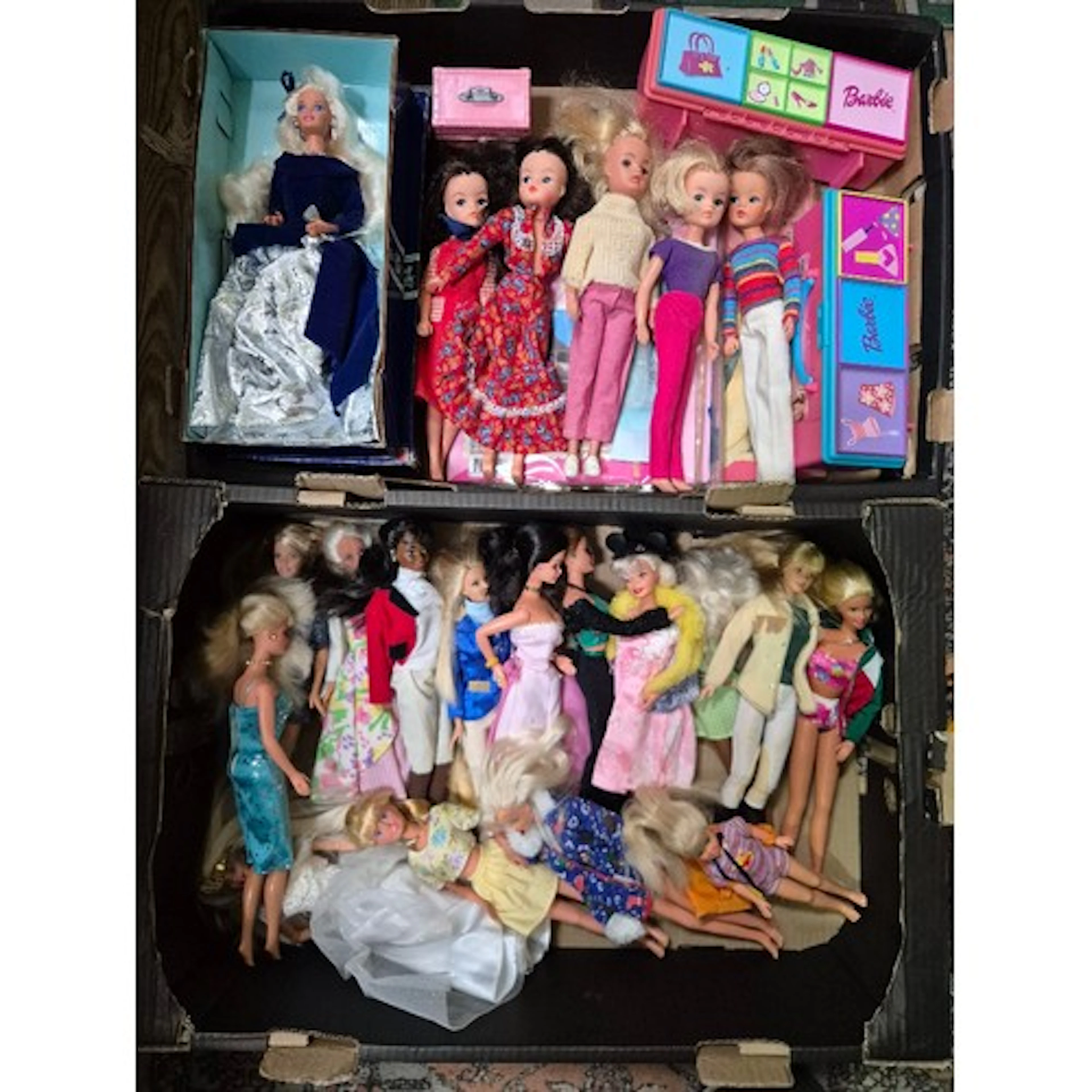 Two boxes of assorted vintage dolls to include Barbie & Sind...