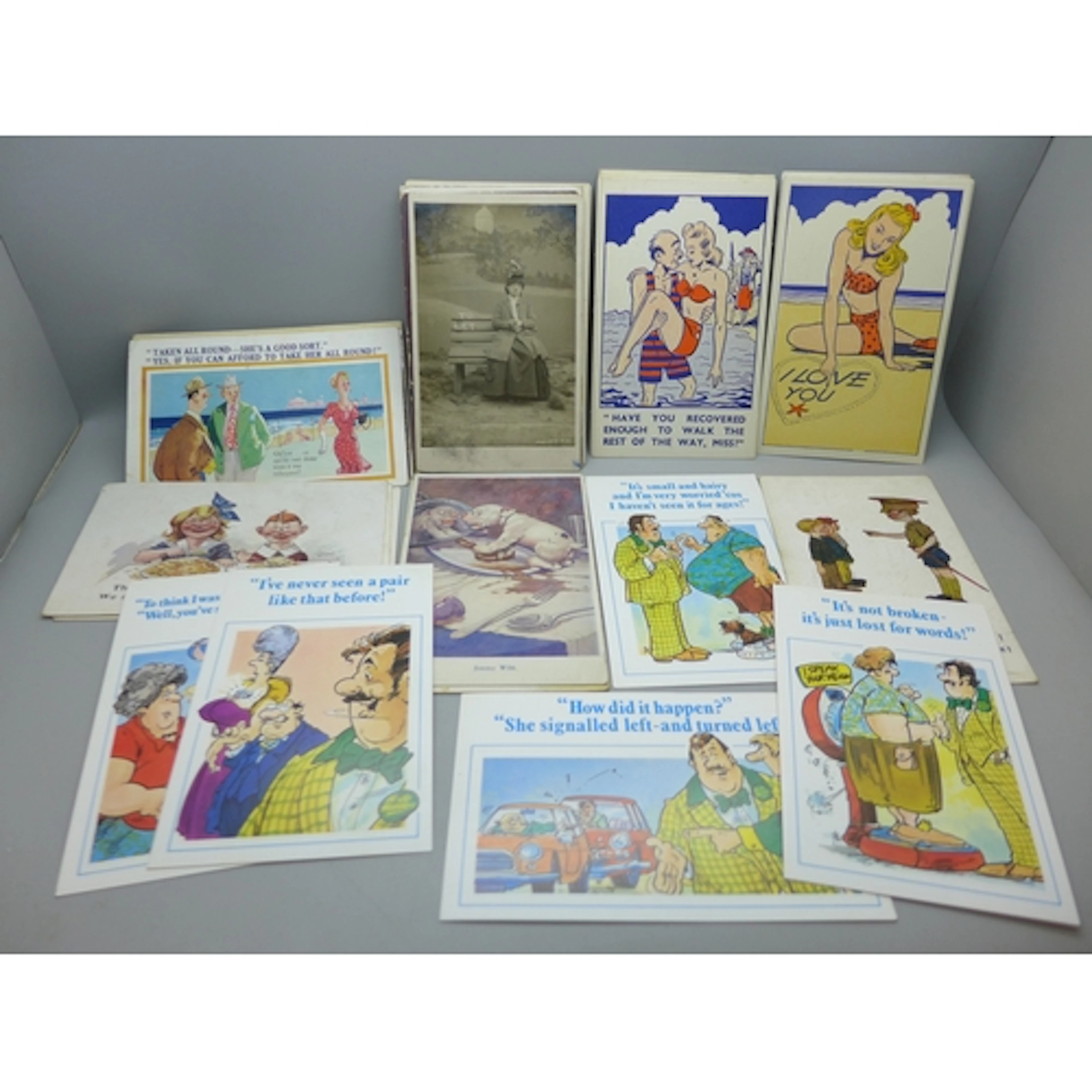 A collection of approximately 60 comic postcards, vintage to...