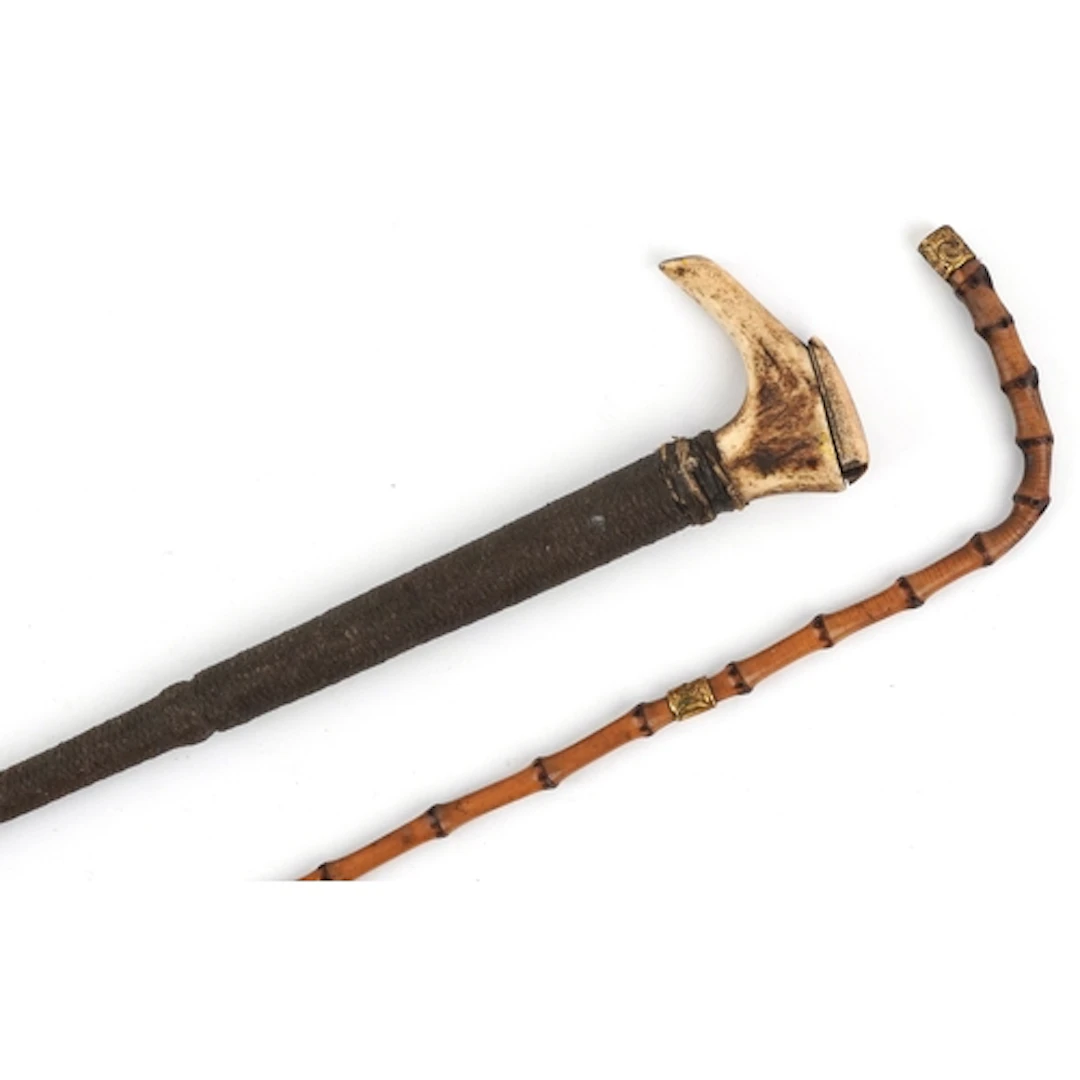 Antique leather whip having staghorn handle and a bamboo whi...