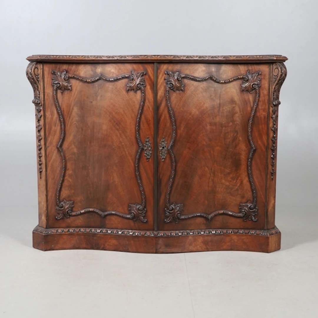 A CHIPPENDALE STYLE MAHOGANY DWARF CABINET. late 19th/early ...
