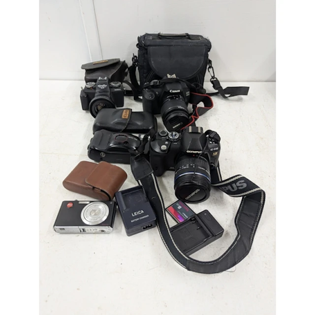 A selection of cameras to include a Canon EOS 1200D, an Olym...