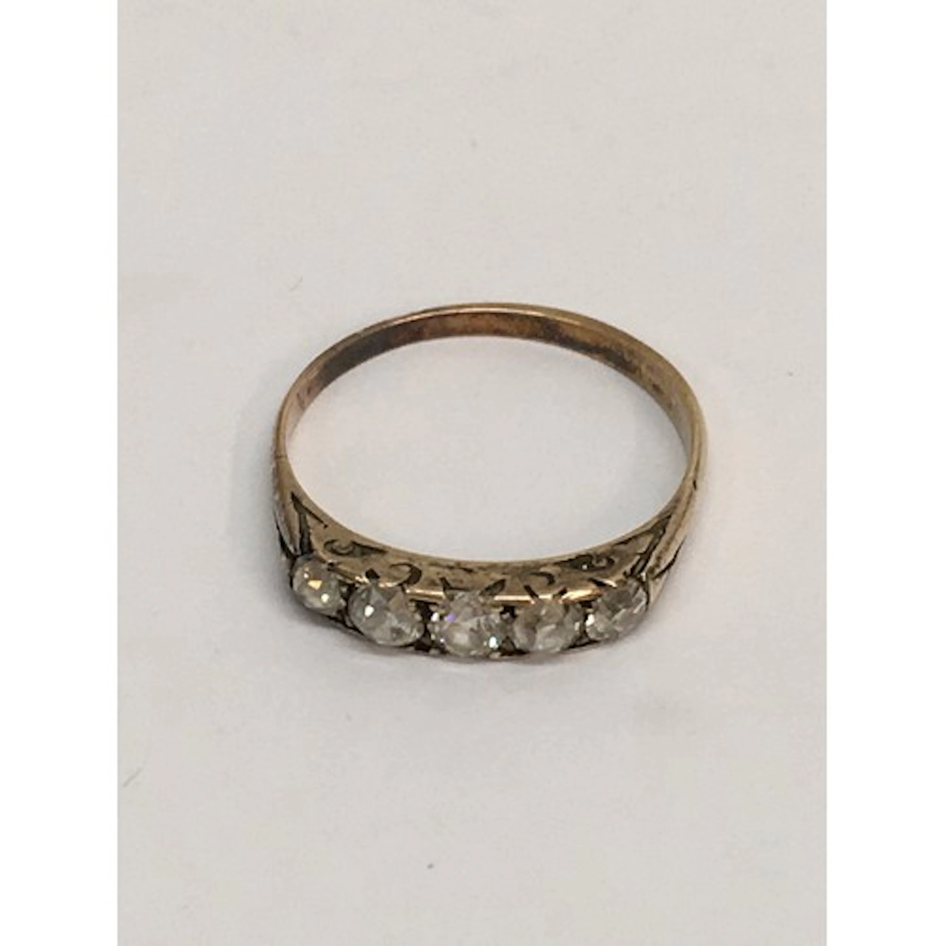 An unmarked gold ring set with old cut probable diamonds. Ap...