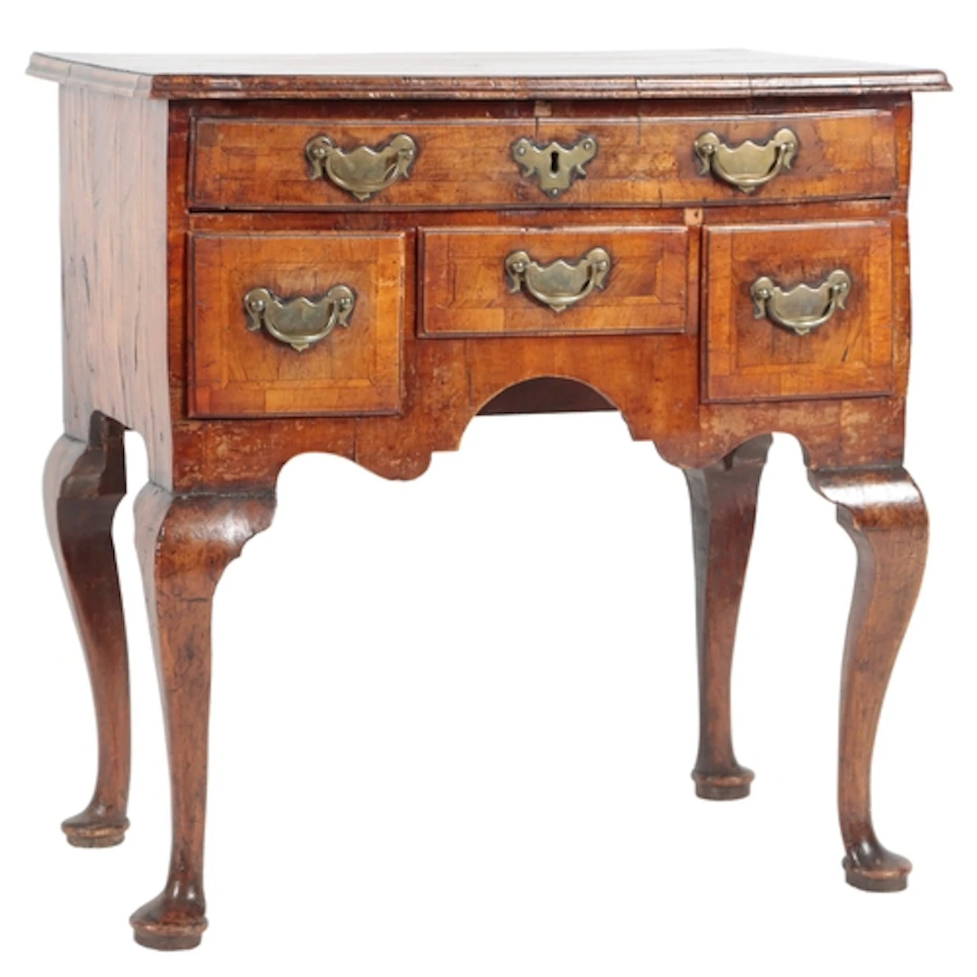 A George I walnut crossbanded side table or lowboy, the quar...