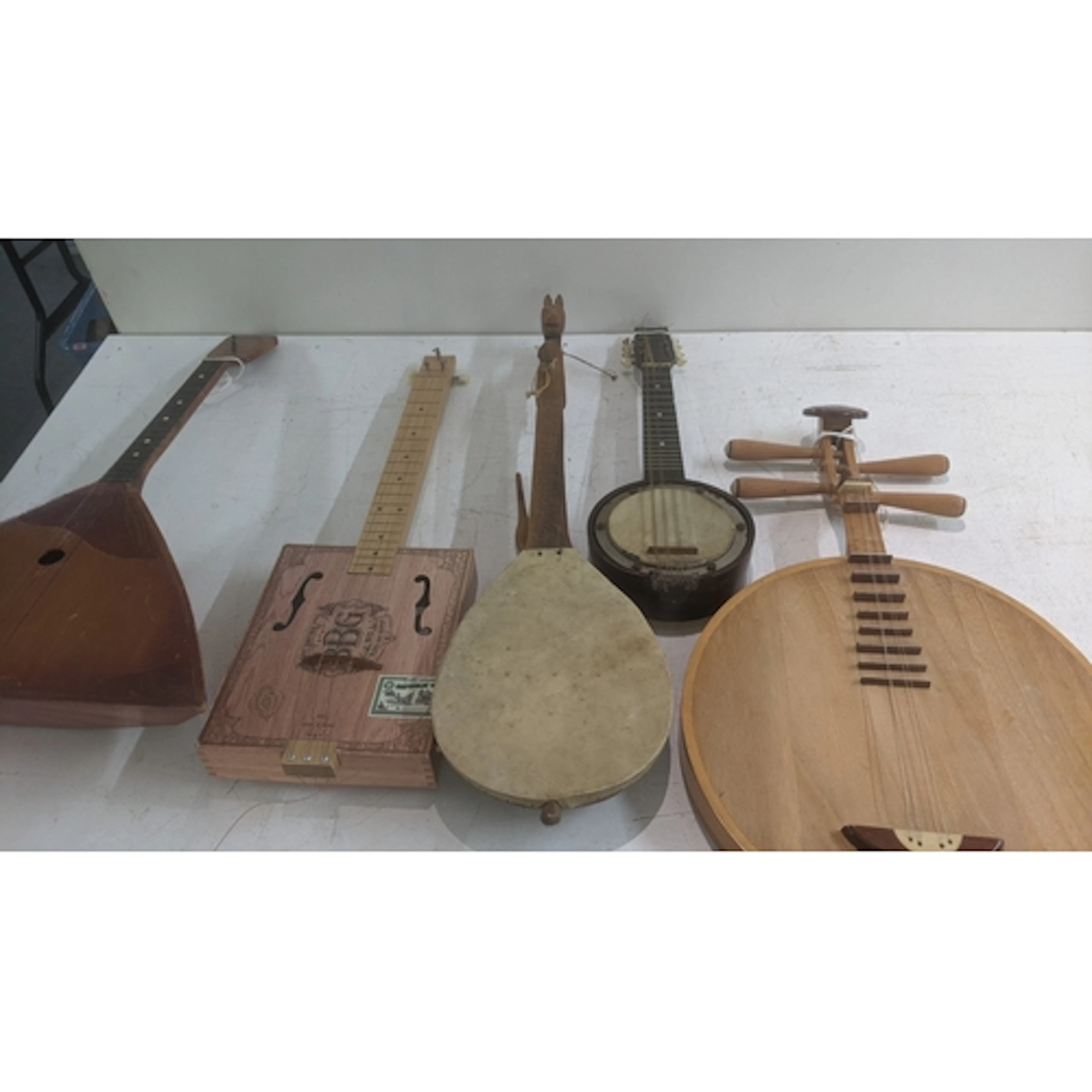 A collection of traditional stringed instruments to include ...