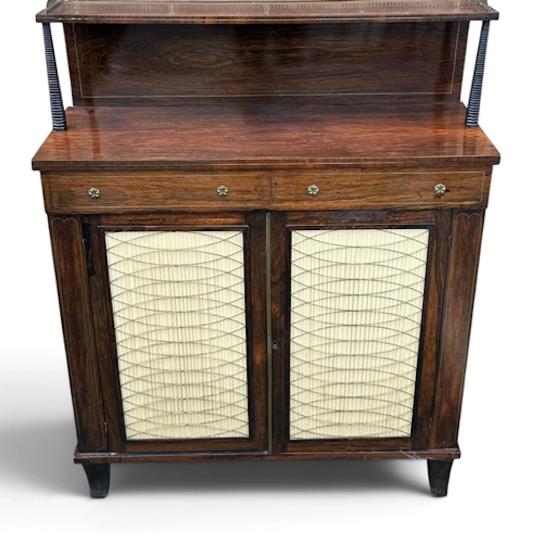 A REGENCY ROSEWOOD CHIFFONIER With brass gallery top and inl...