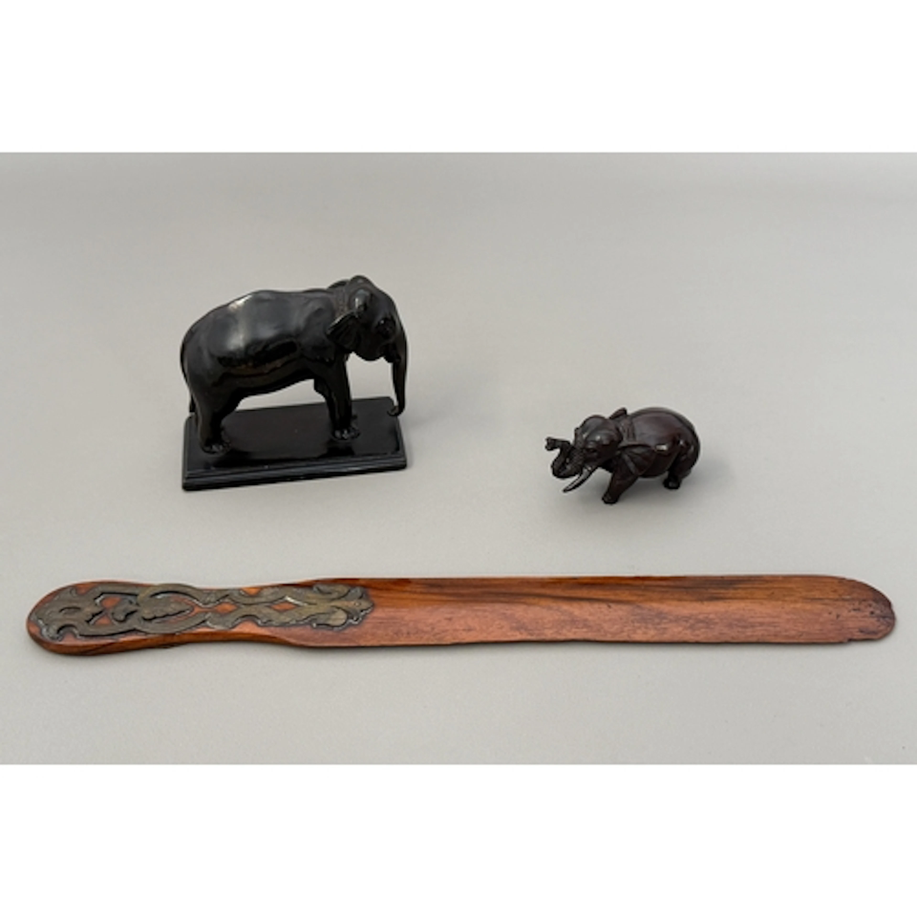 A c.1900 metal-mounted wooden page turner, 30cm long, a smal...