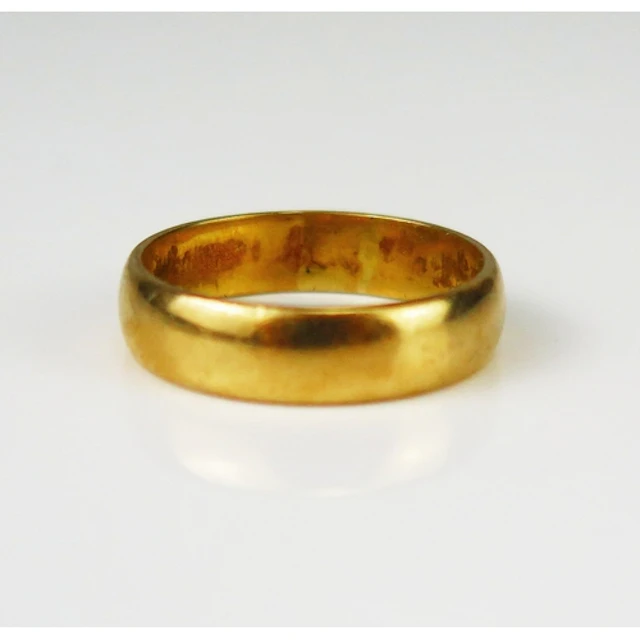 An 18ct gold plain wedding band, 5.3mm wide, size S.5, hallm...