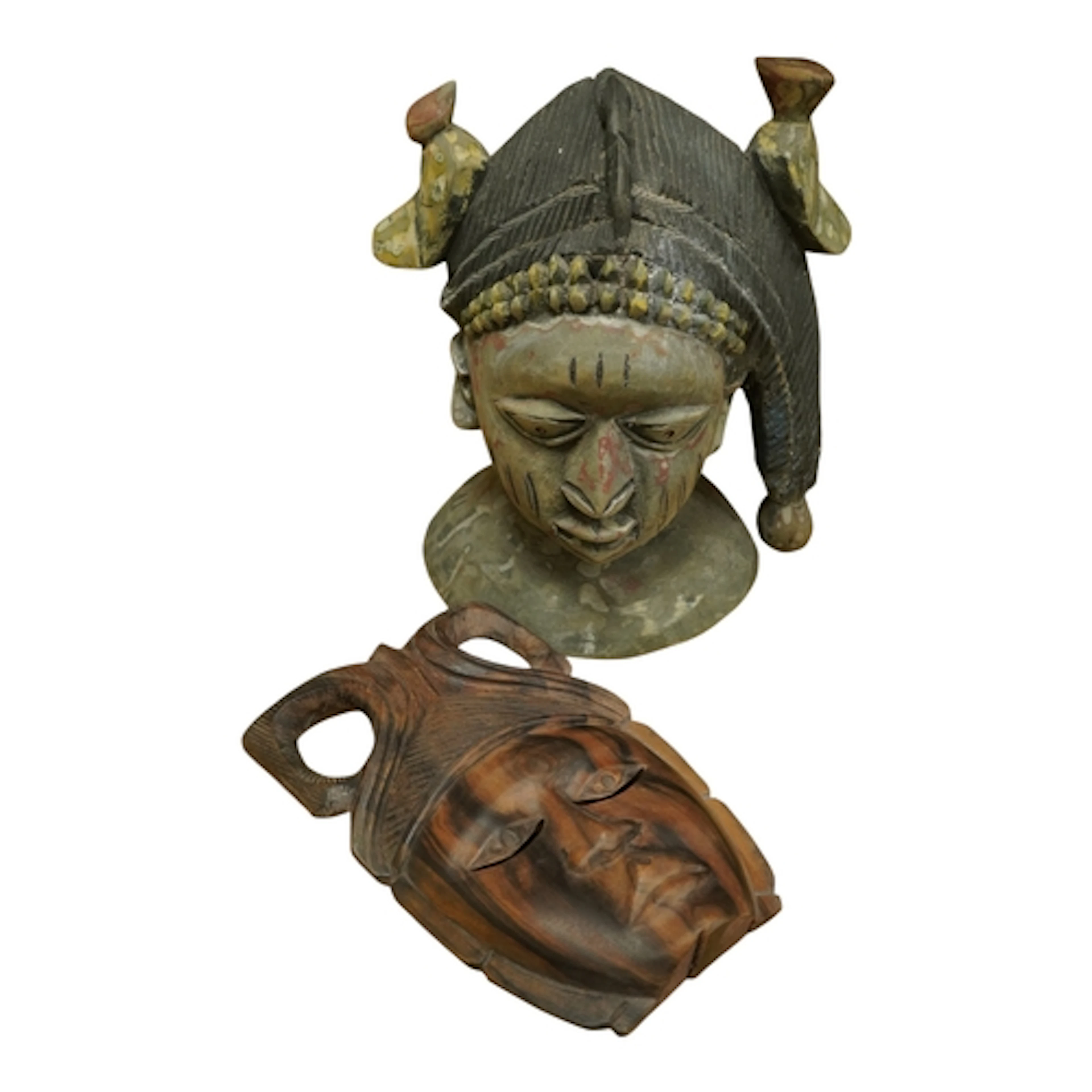 A West African polychrome head and an ebony mask, largest 36...