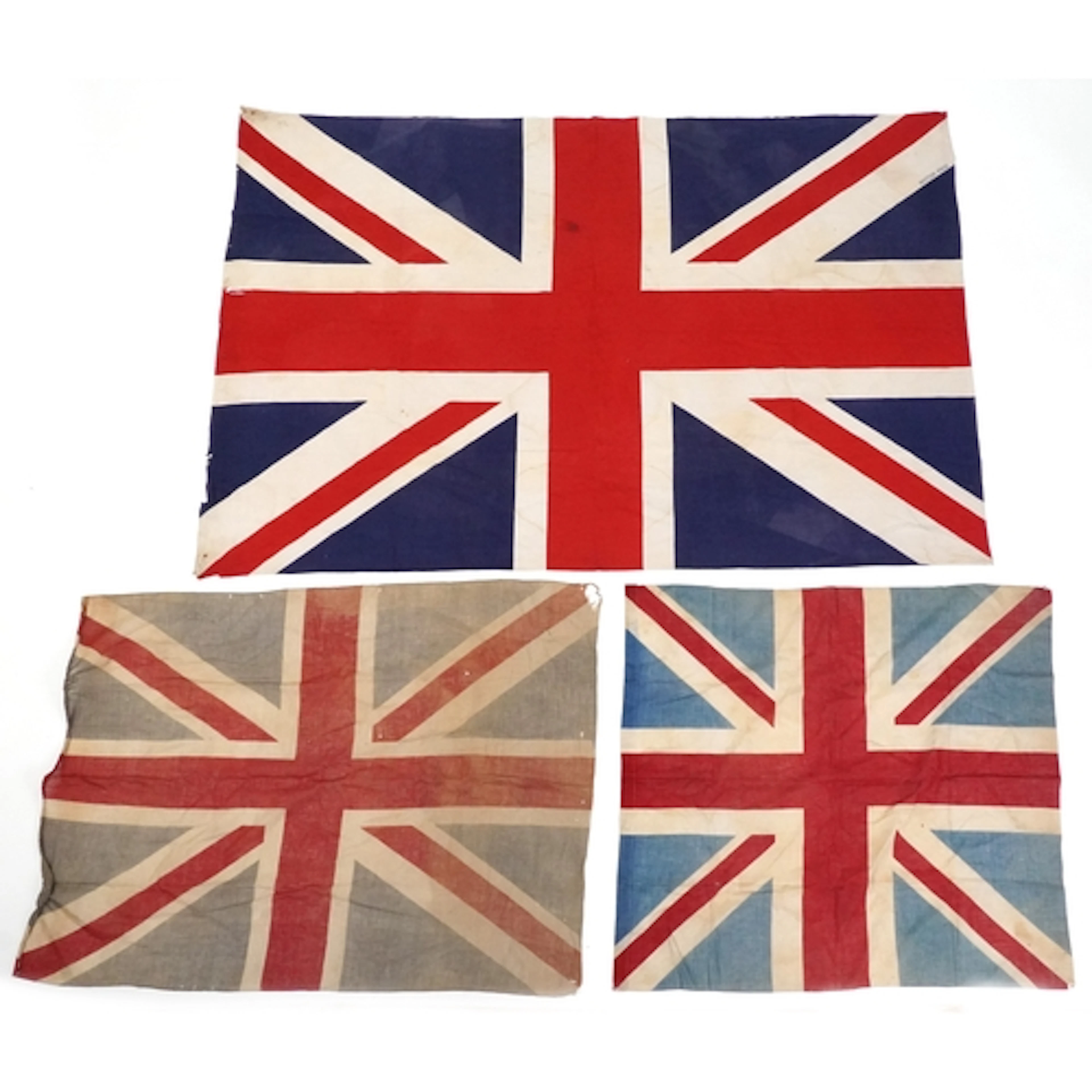 Three vintage Union Jack flags, the largest 174cm in length.