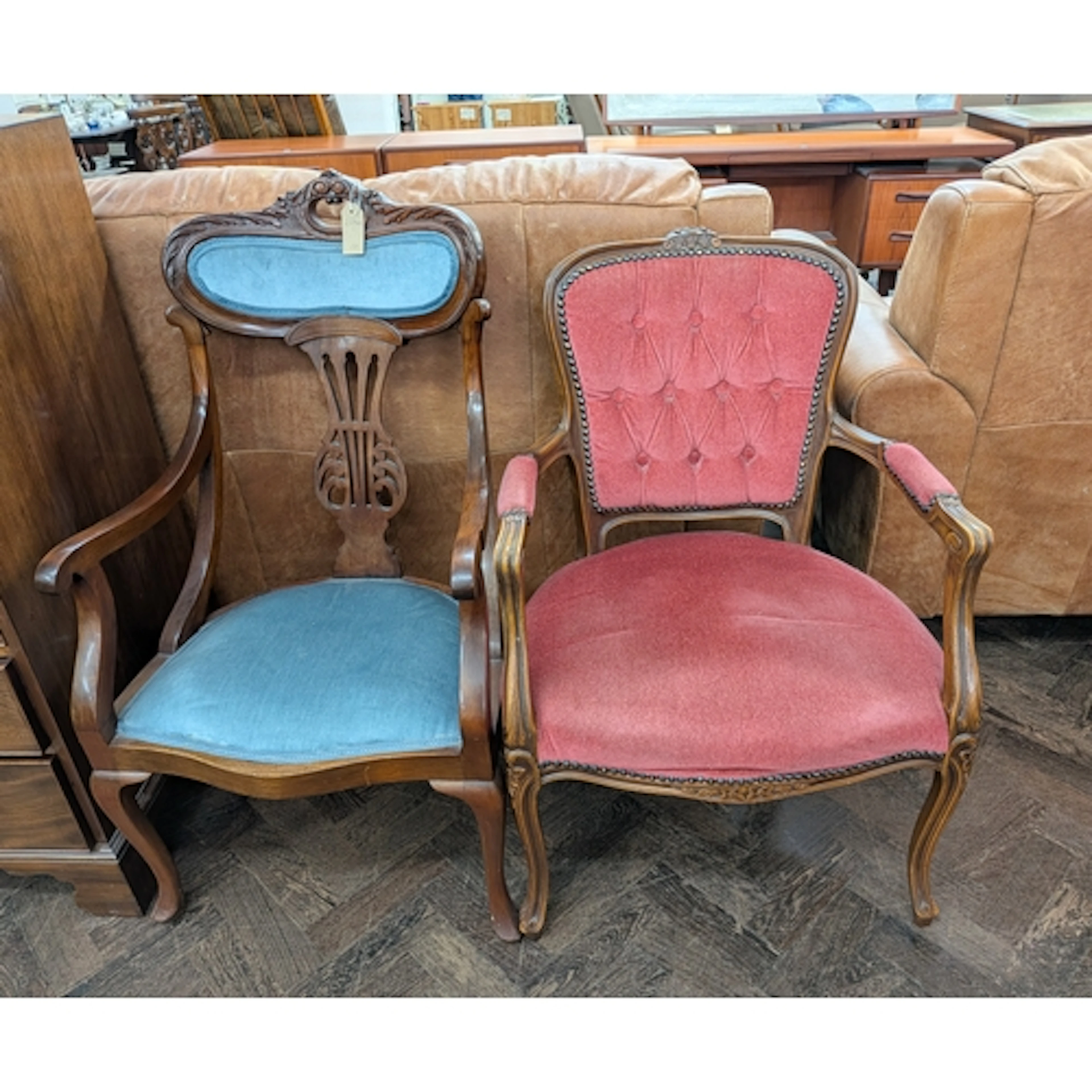An Edwardian blue upholstered chair and a pink French style ...