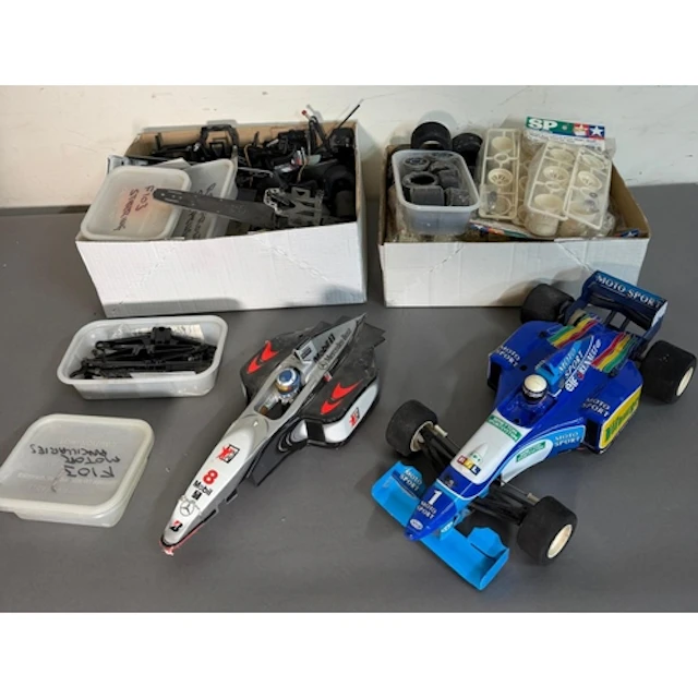 A Tamiya Benneton Formula 1 radio control car together with ...