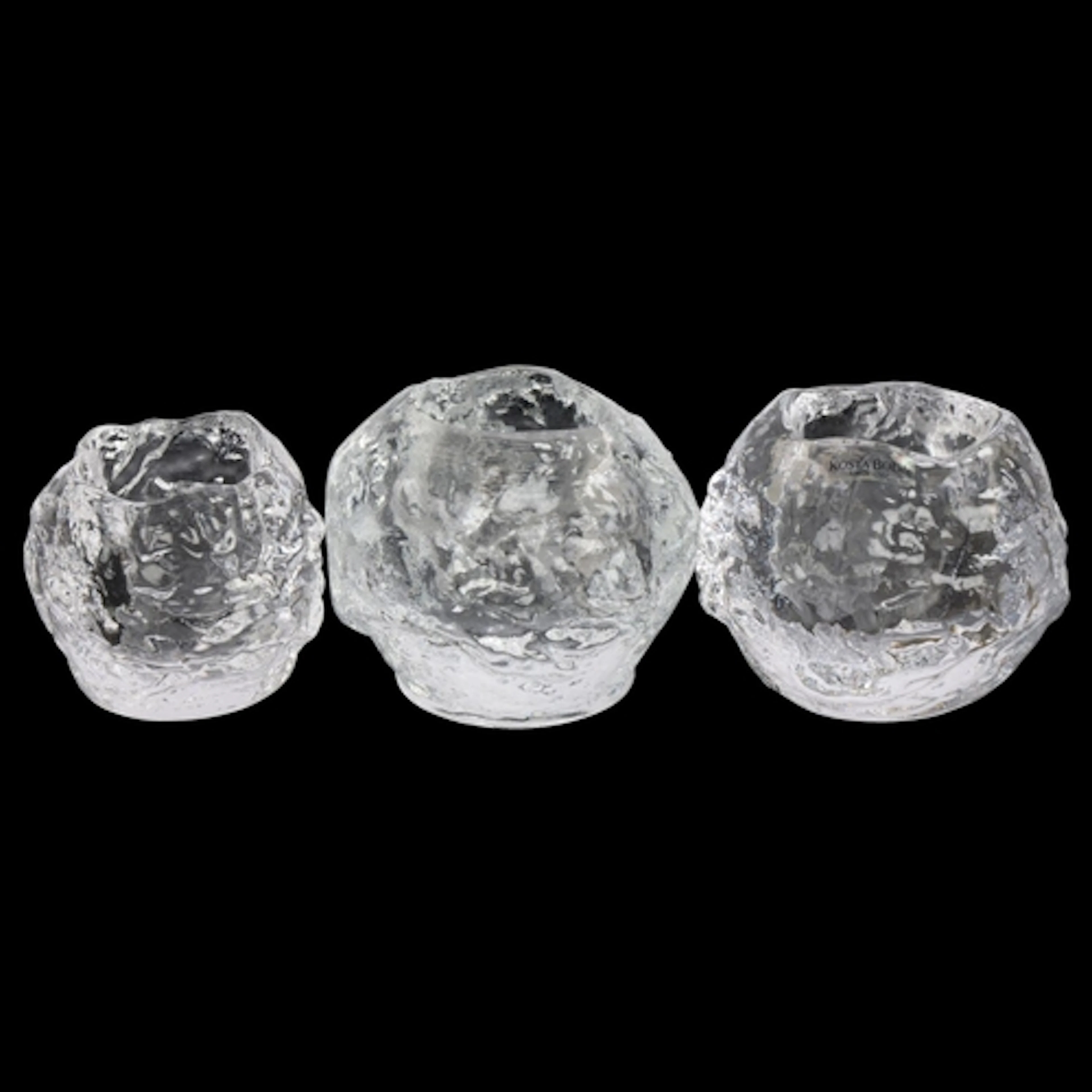 Three Kosta Boda clear glass Snowball tea light holders, one...