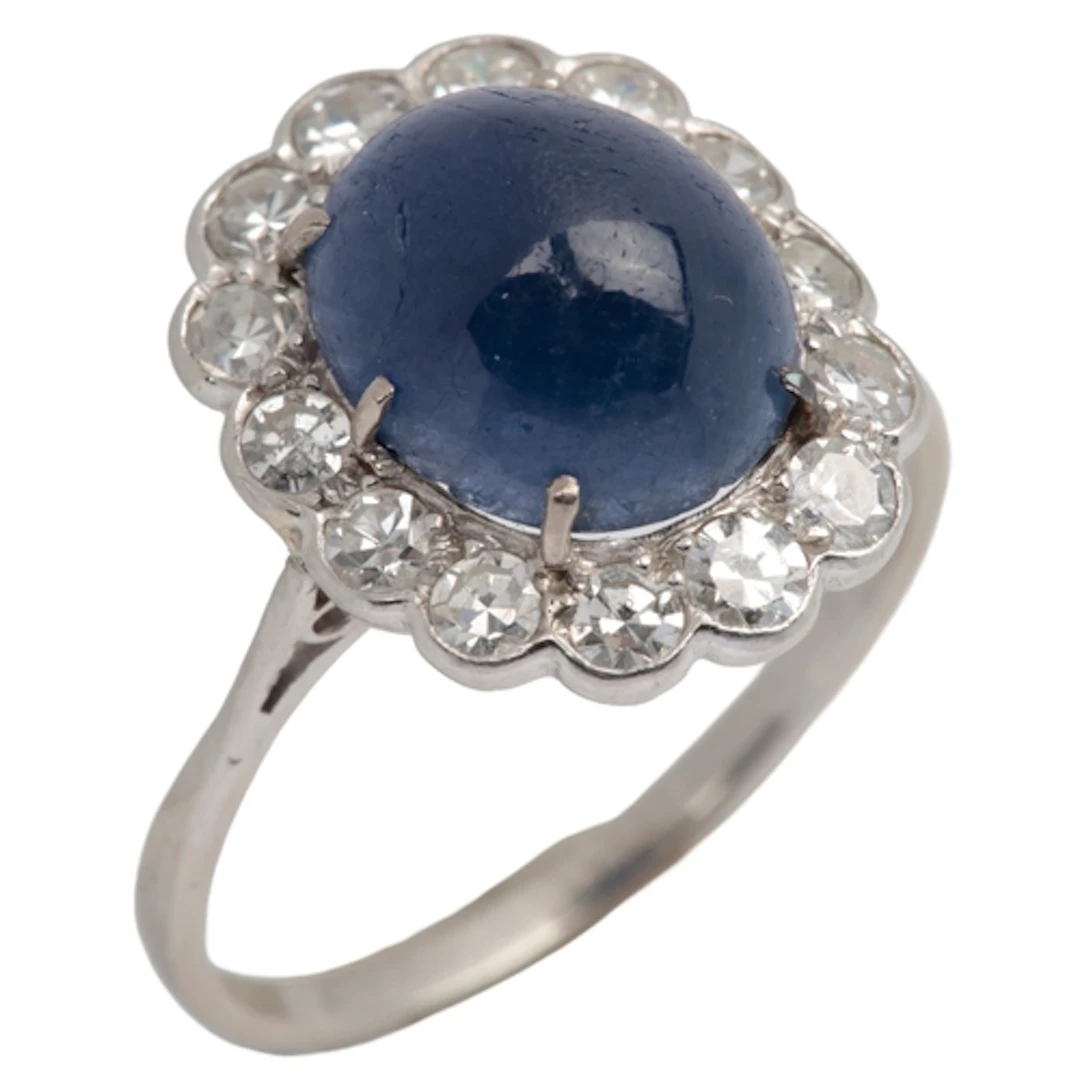 A sapphire and diamond cluster ring, early 20th century, cla...