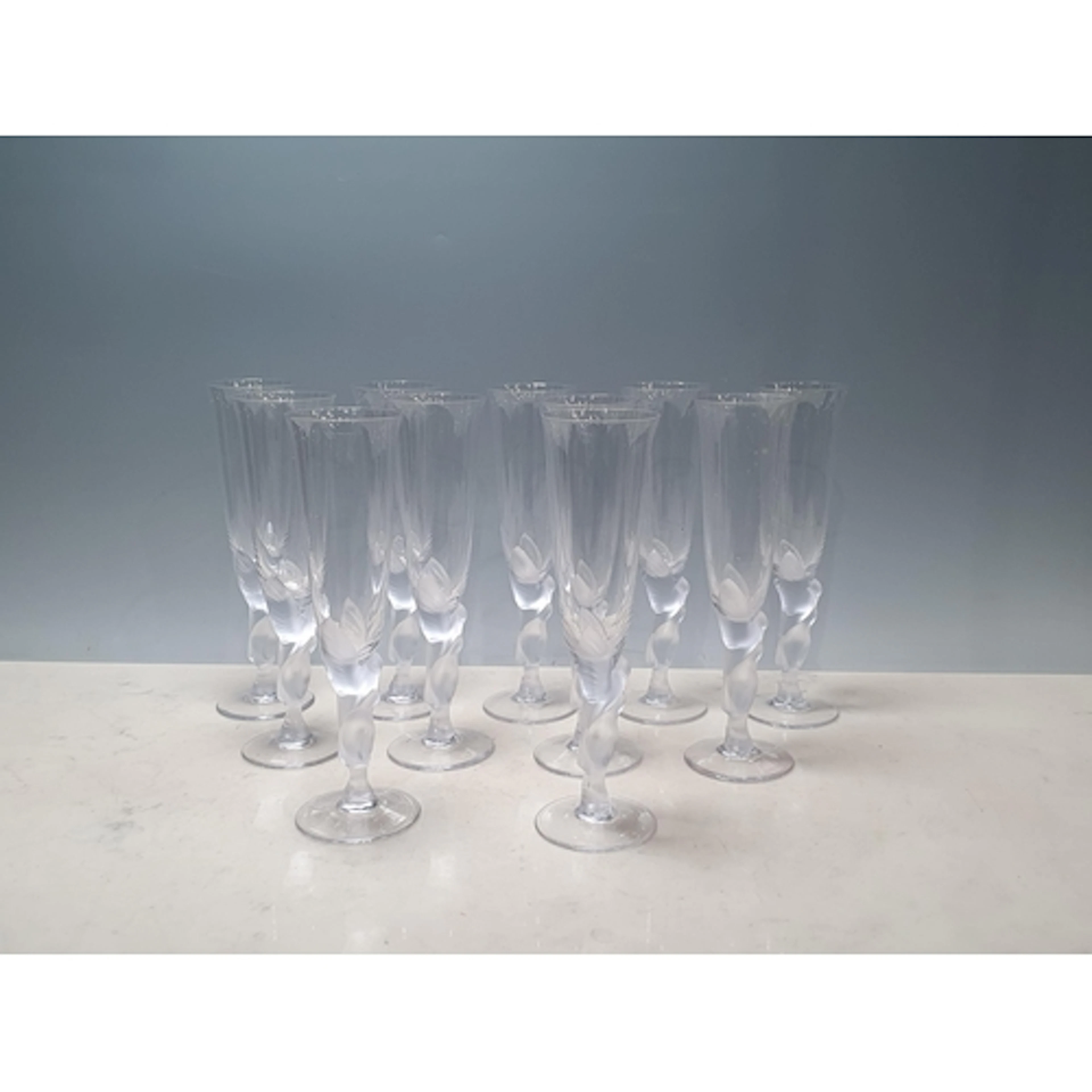 A Set of eleven Faberge Kissing Doves Champagne Flutes, sign...